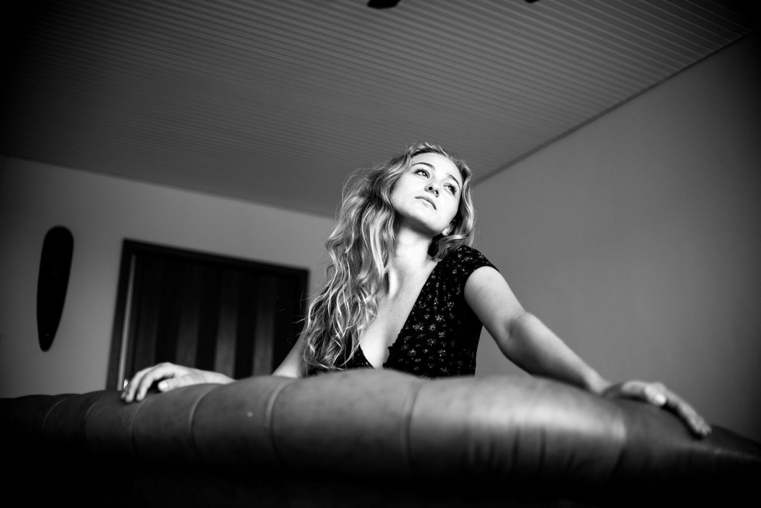 Artistic black and white portraits with dramatic vignette and unique camera angles.