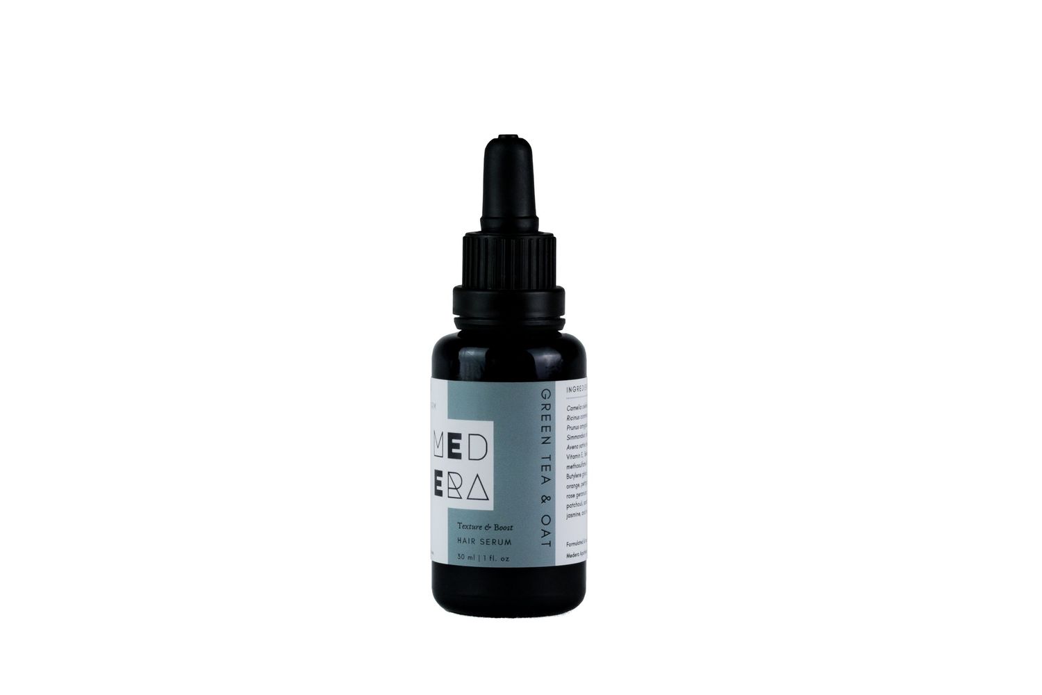 Black dropper bottle with essential oil or serum against white background.