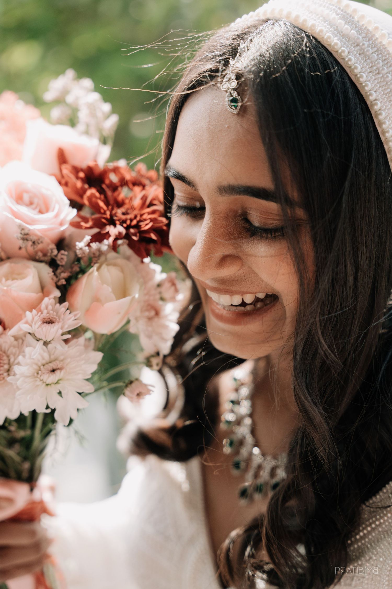 Close up portrait with pink roses and delicate flowers.