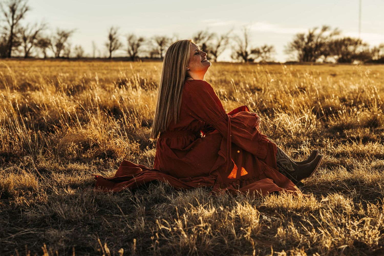 A series of sunset photos showing someone sitting in golden grass fields at different angles during magic hour.