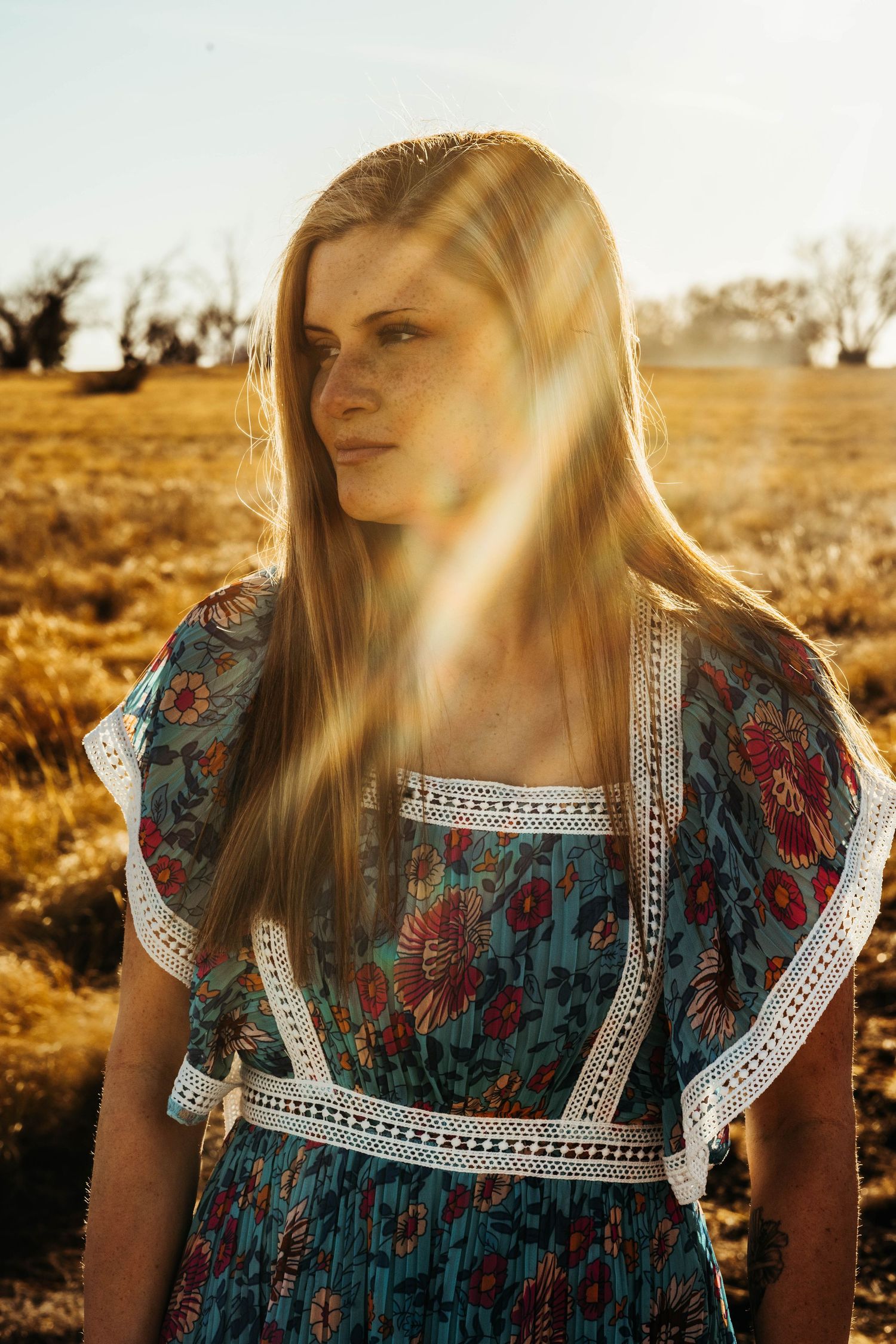 A series of five similar photos showing sunlit floral dress details with lace trim in a golden outdoor setting.
