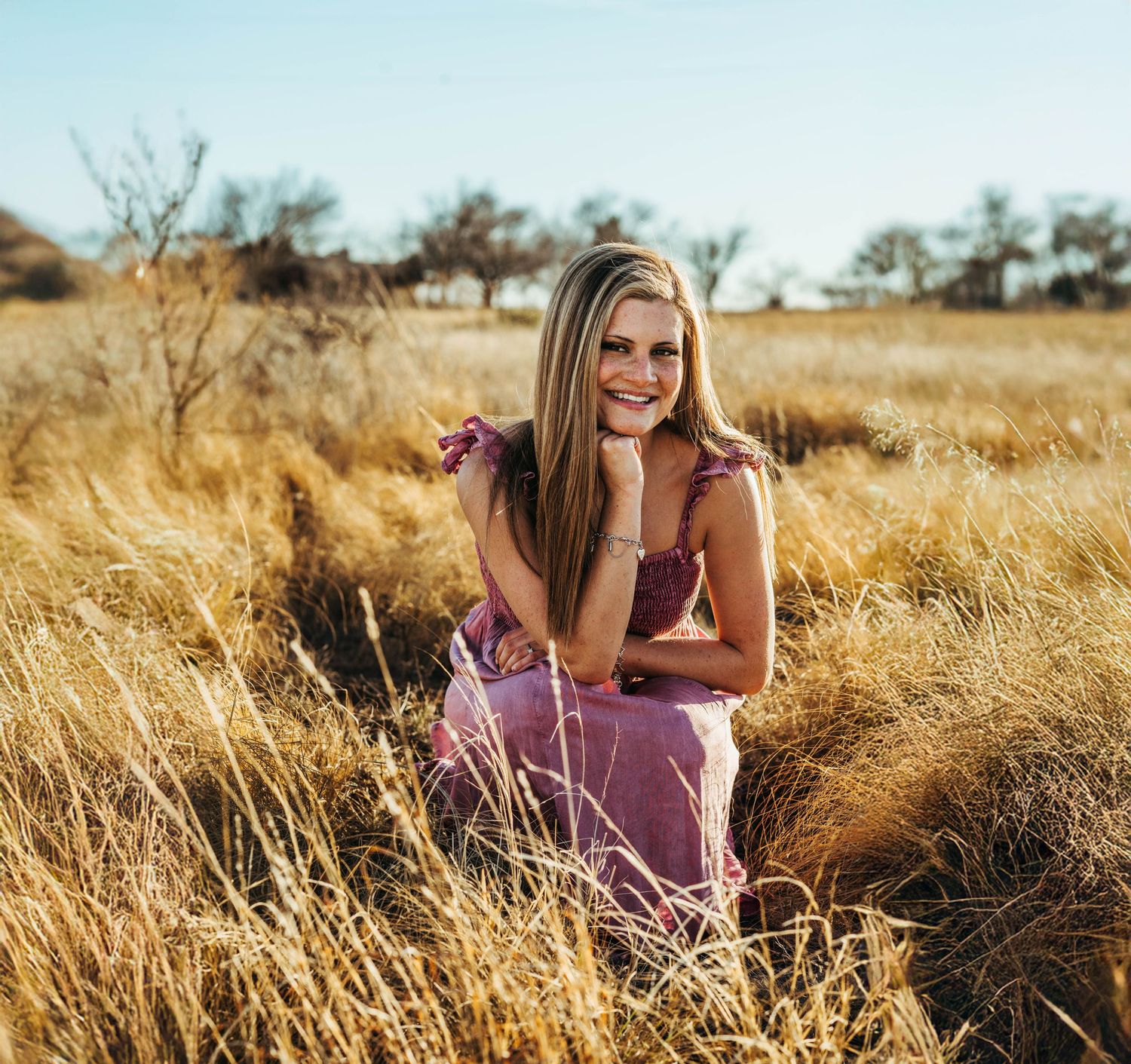 Scenic golden wheat field at sunset with soft natural lighting creating a warm and dreamy outdoor atmosphere.
