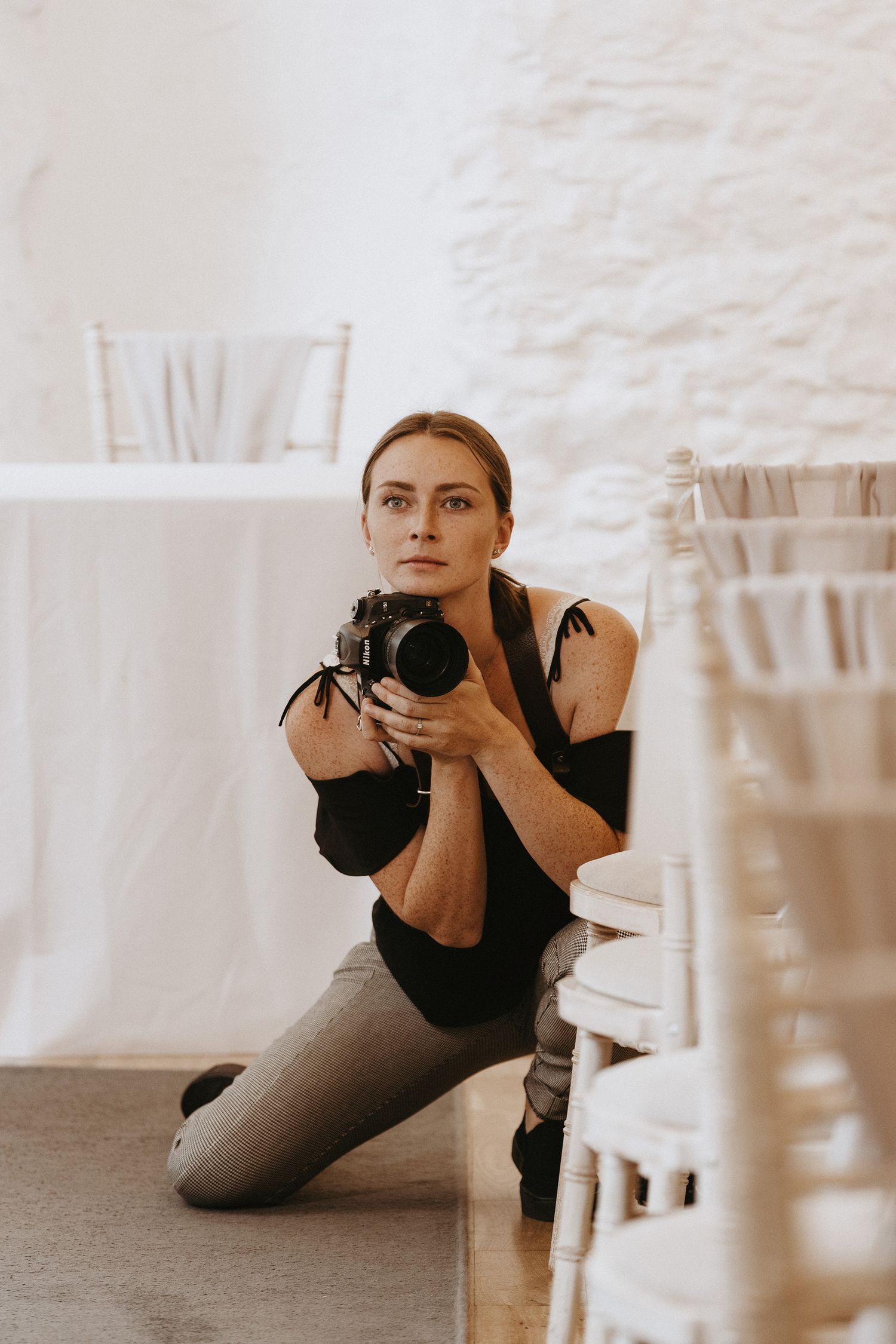 Daniella Pengelly Photography holding a professional camera at Bickley Mill Inn.