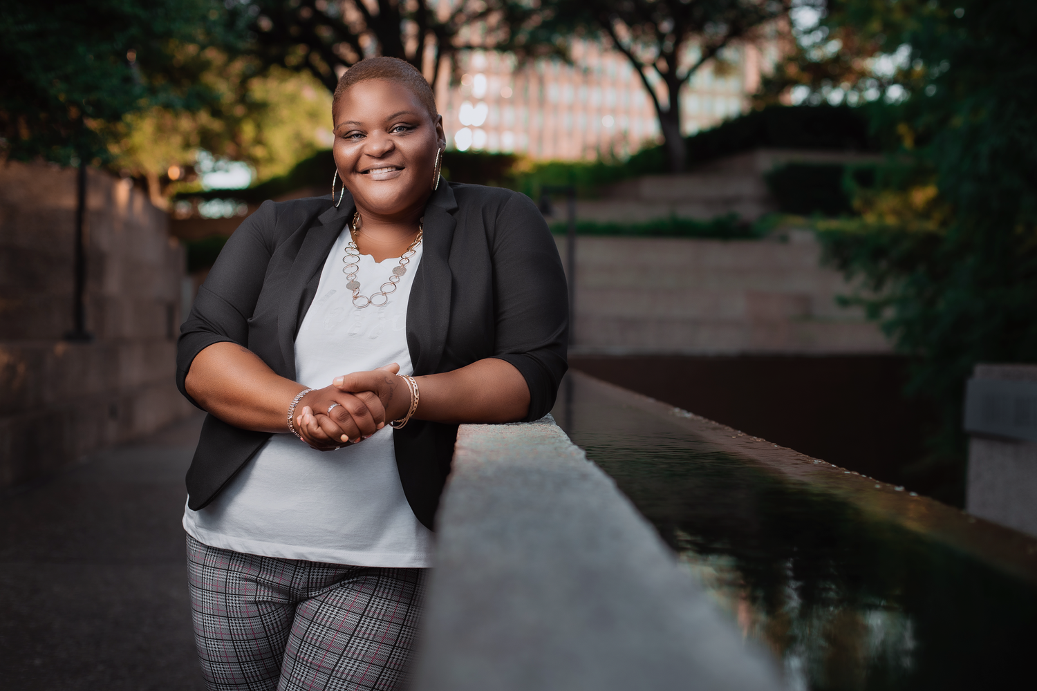 Professional portrait session in an urban park during evening hours.