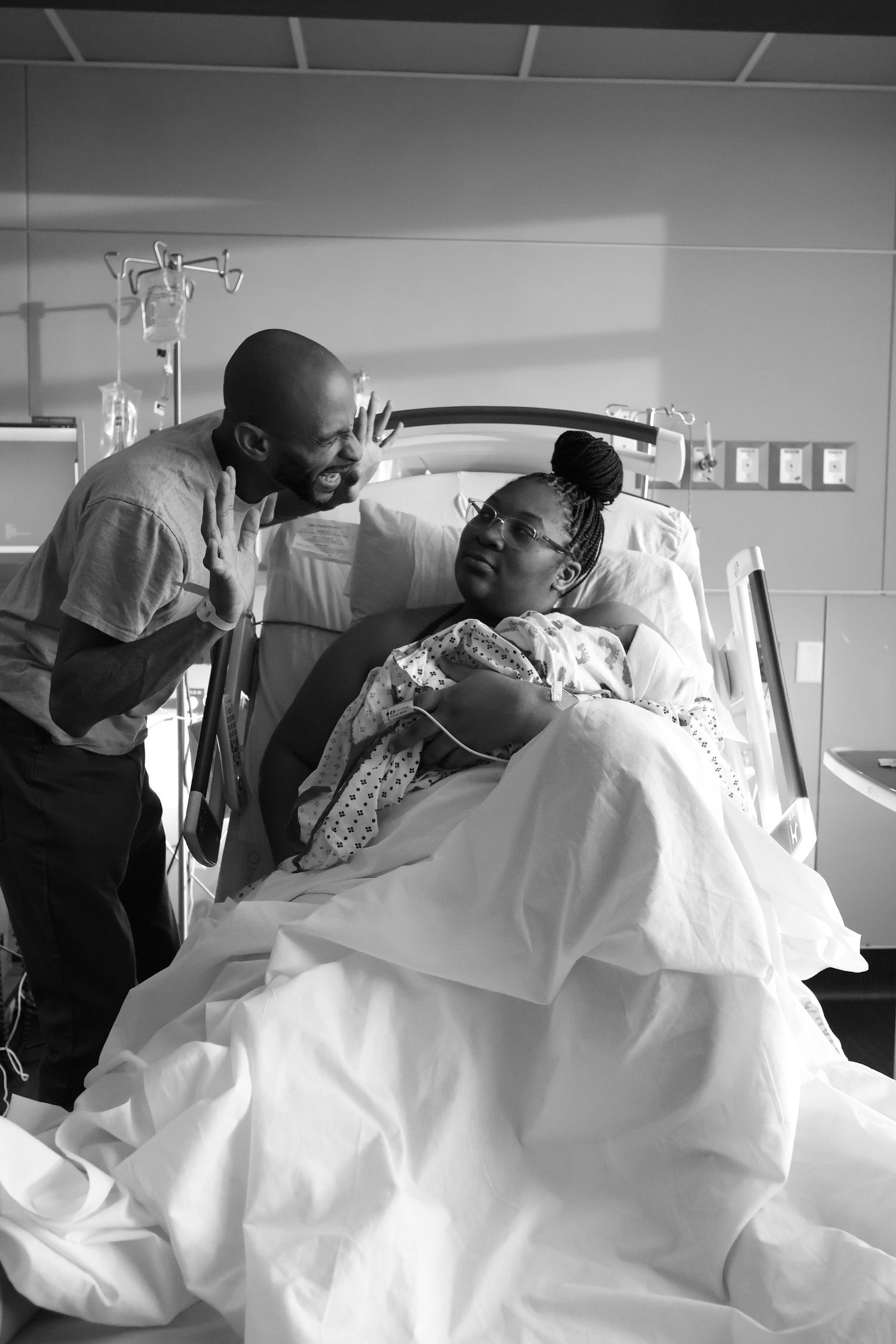 A series of black and white medical photos showing a patient receiving care in a hospital bed.