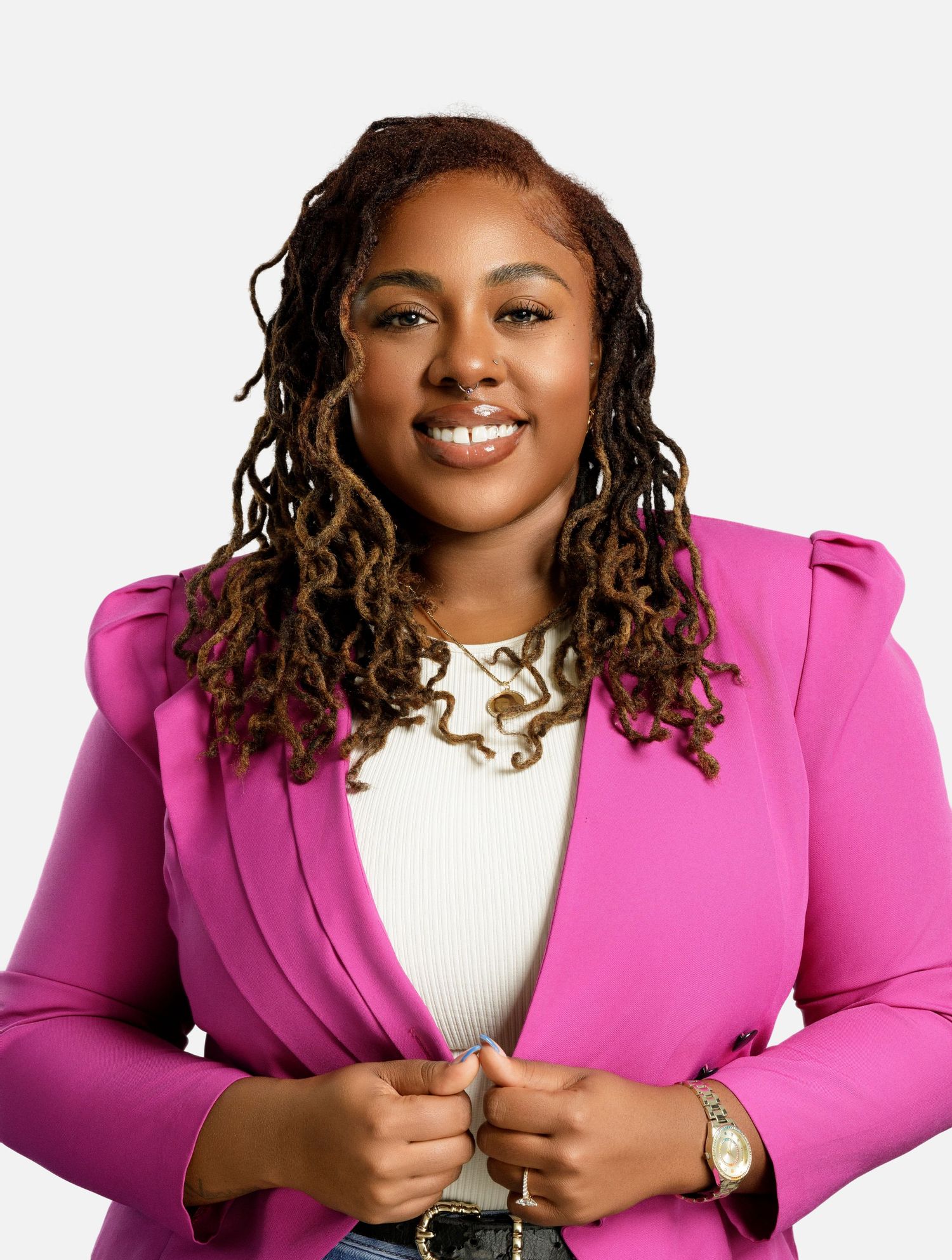 Professional headshots featuring bright pink blazer and white top with gold accessories.