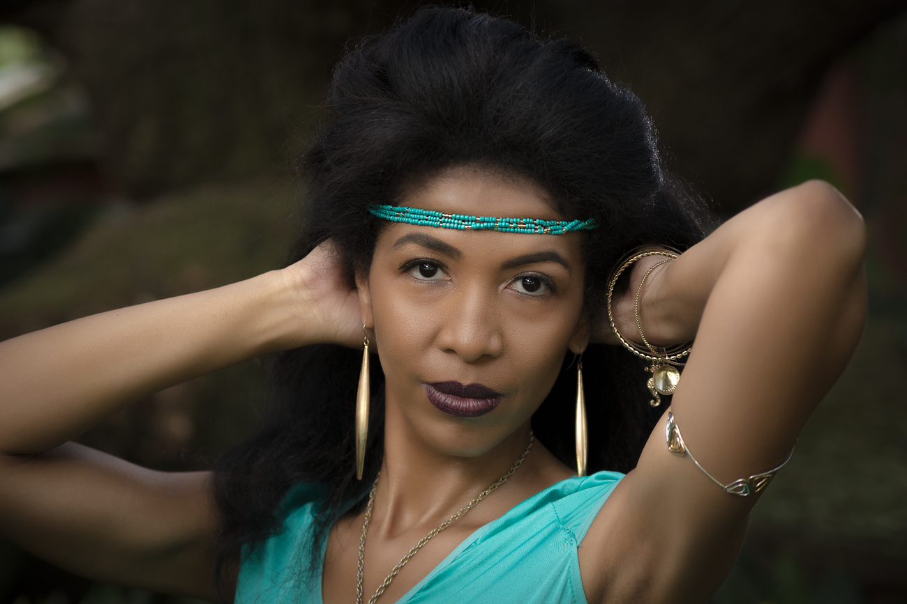 Portrait series in turquoise outfit against natural outdoor setting.