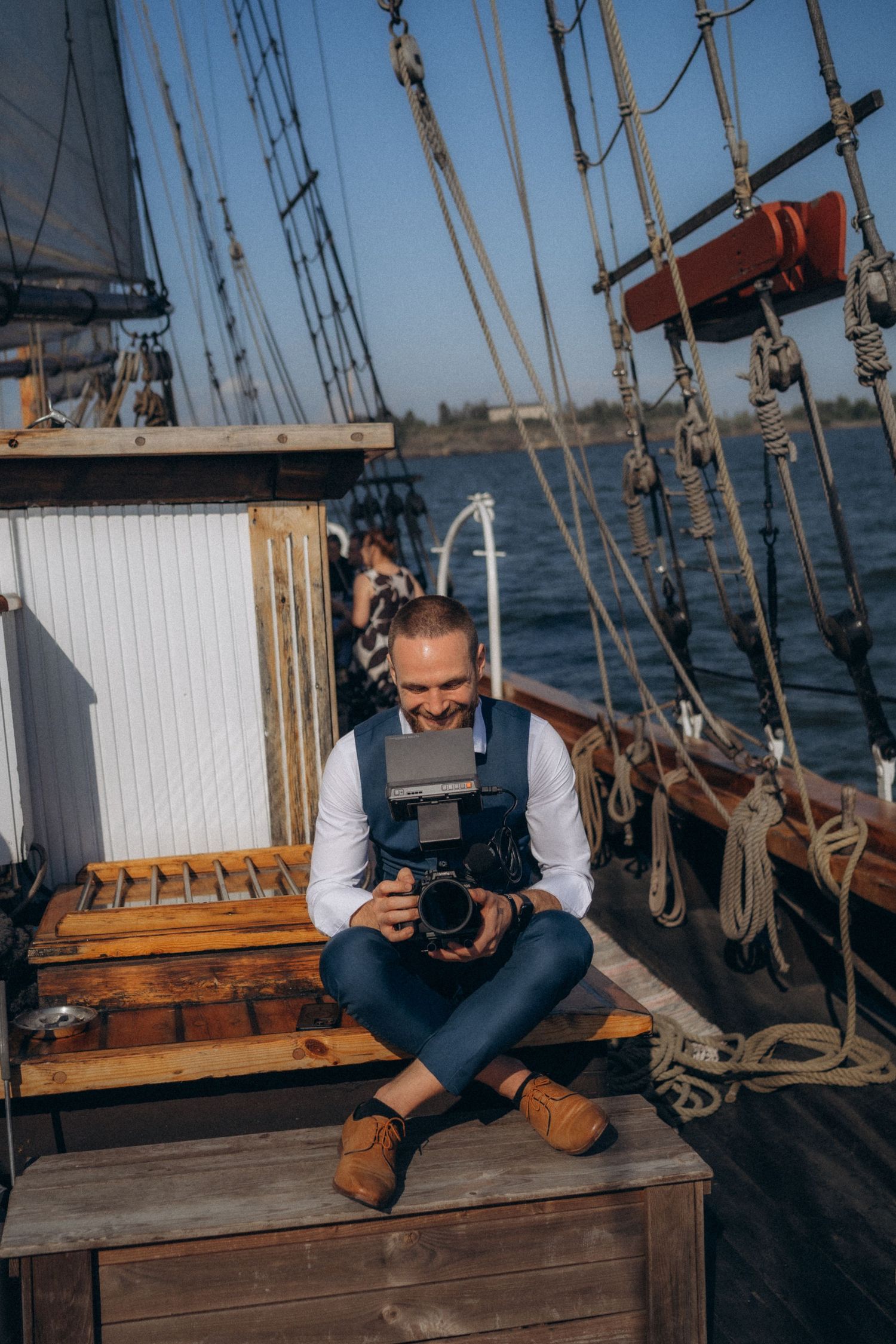 Wedding videographer filming authentic moments during modern cinematic wedding coverage