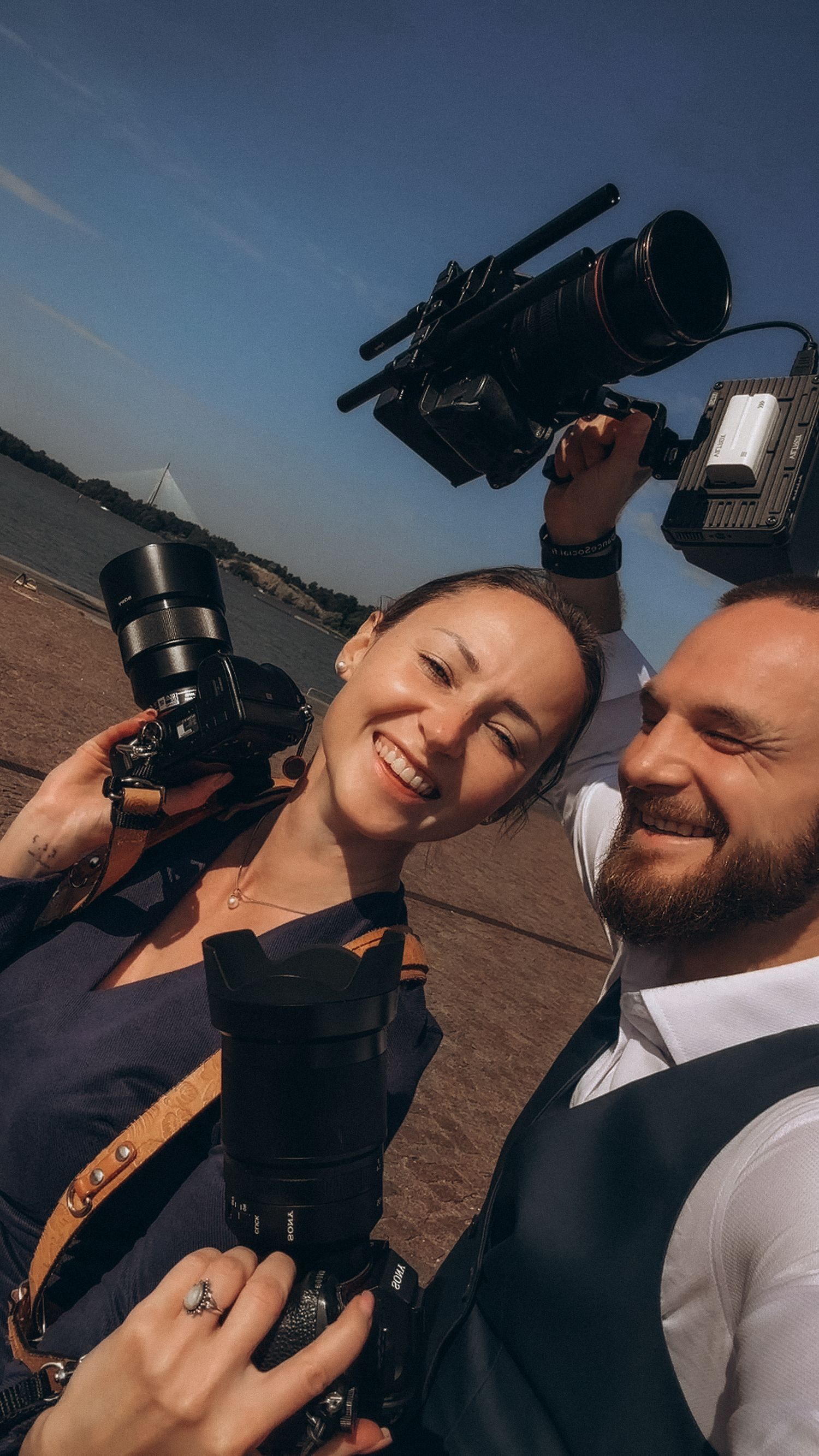 Photo and video wedding team working intuitively together to capture emotional moments