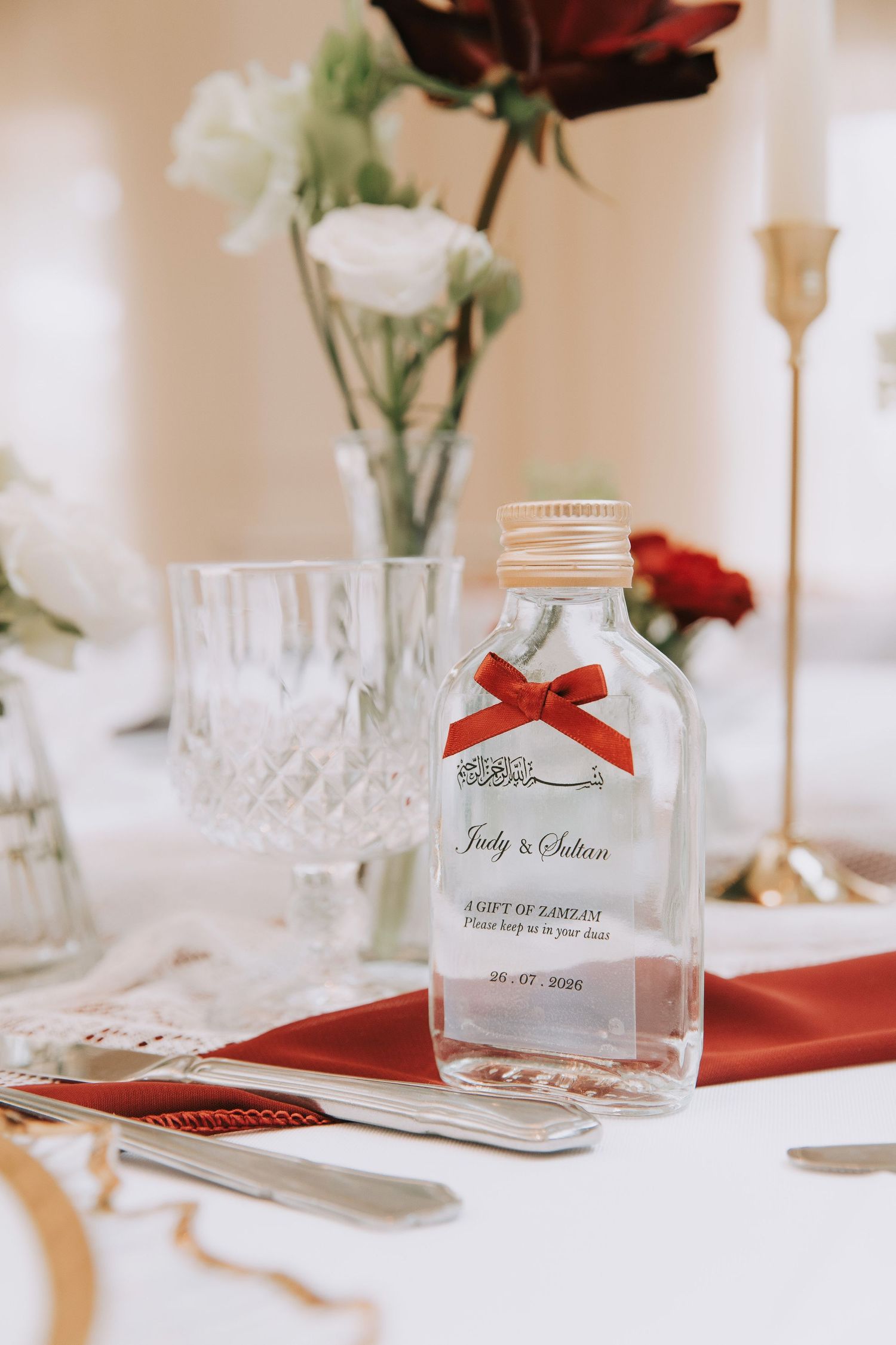 Wedding favor ZamZam bottle with red bow and personalized label Arabic Calligraphy Prested Hall Engagement