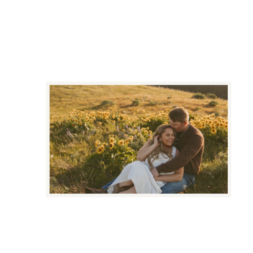 Couple sharing an intimate moment in a field of yellow wildflowers at sunset.