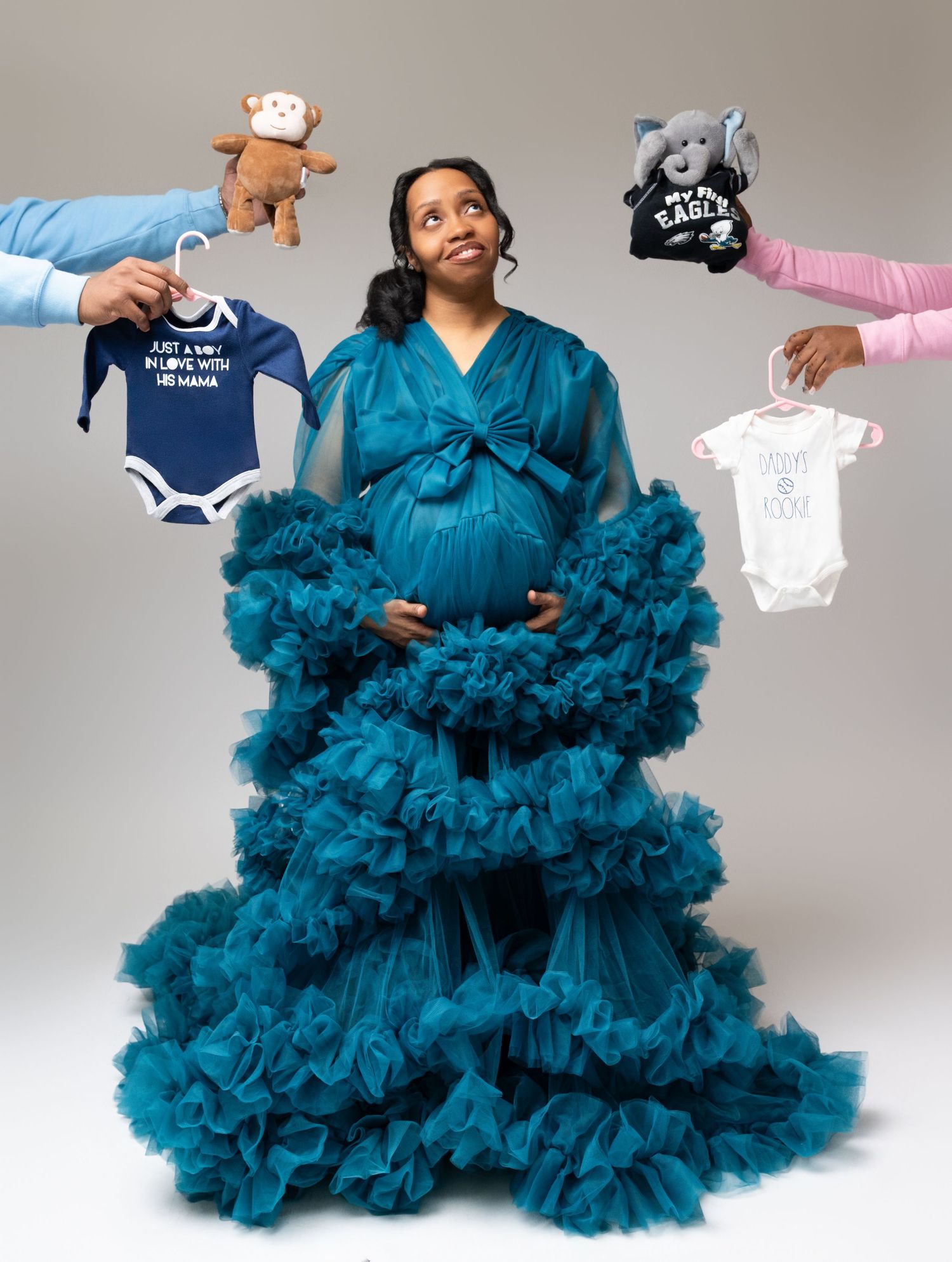 Compilation of photos showing a dramatic teal tulle dress being displayed from different angles and distances.