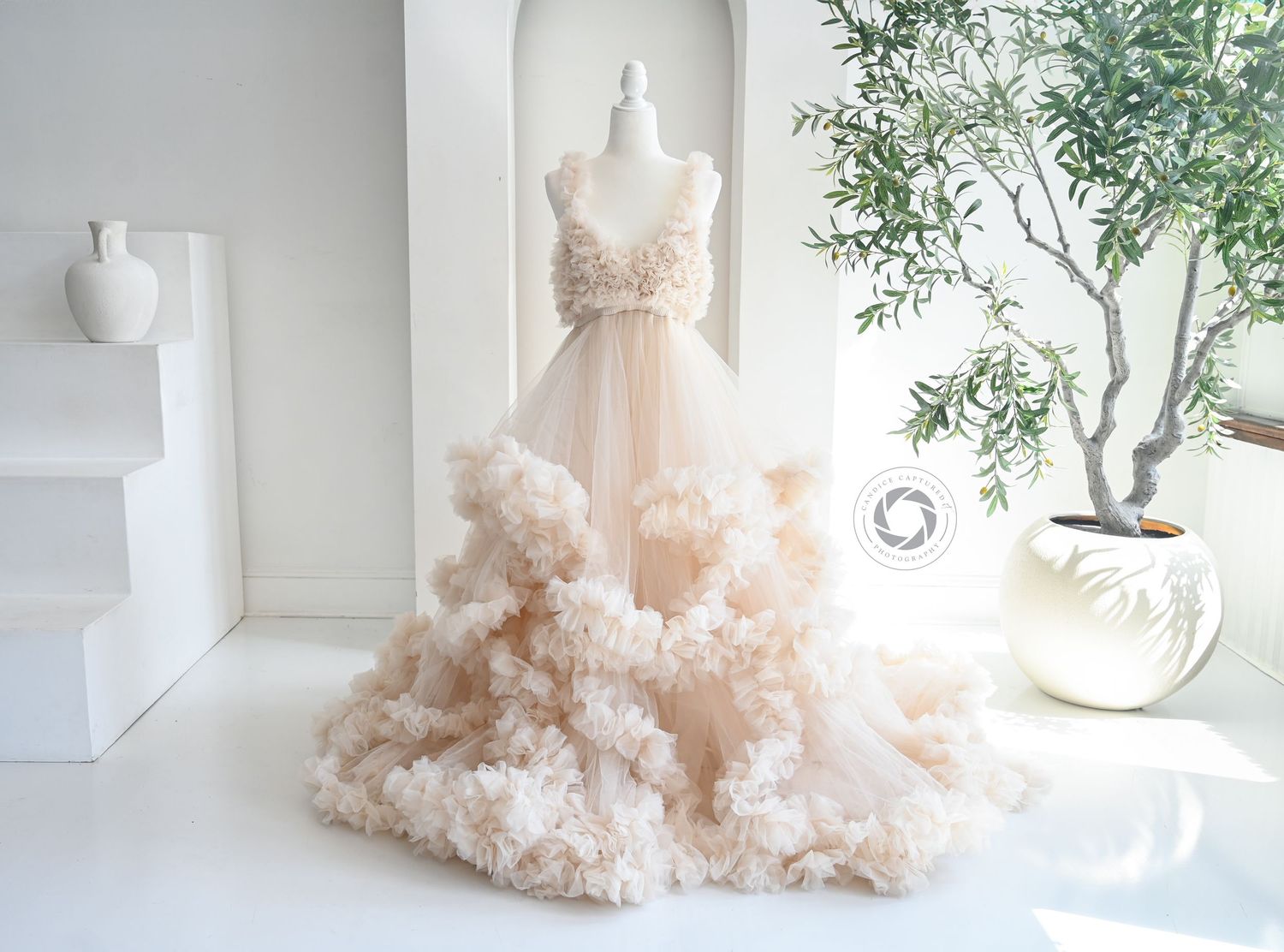 A flowing blush pink tulle gown is photographed in natural window light across multiple angles and frames.