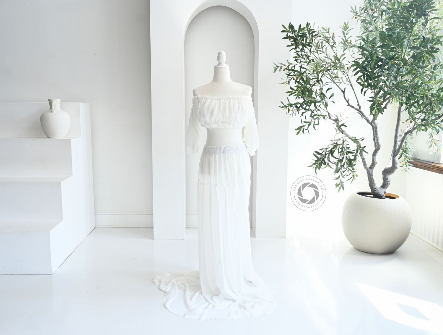A serene collection of minimalist white interior vignettes with delicate greenery and ceramic decor against bright backgrounds.