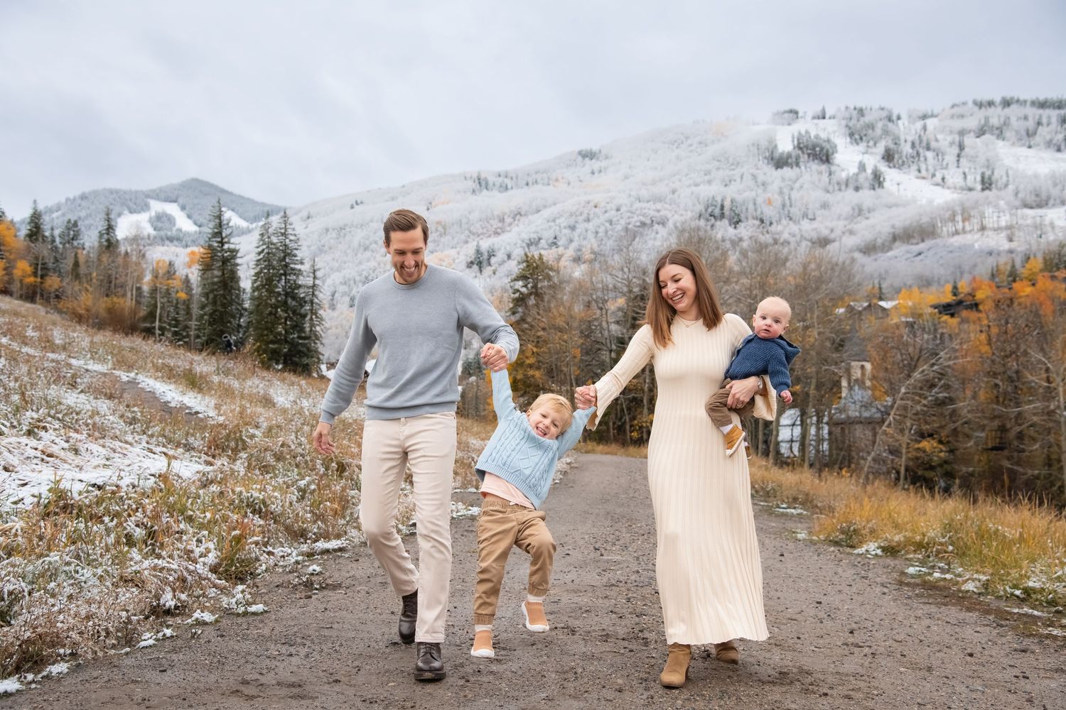 Cute candid family photo session in Beaver Creek Colorado with a fashionable family walking candidly with two young kids