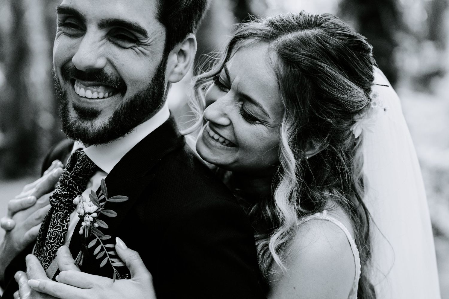 Intimate black and white portraits of newlyweds sharing tender moments.