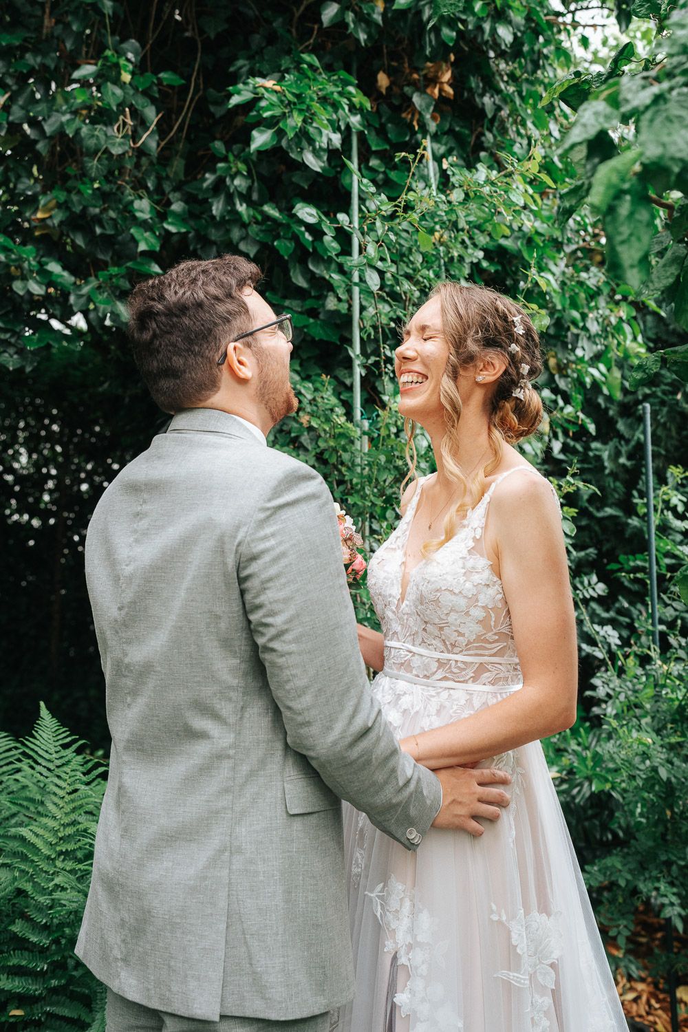 An intimate wedding photo sequence showing a couple's loving embrace against a backdrop of greenery.
