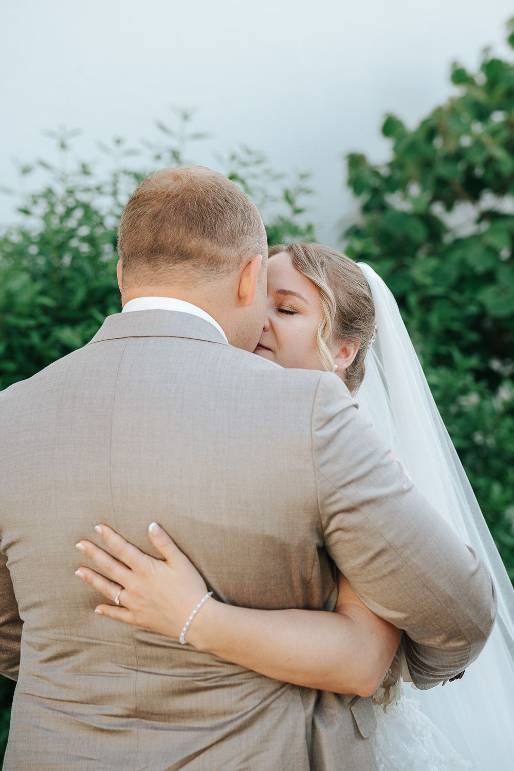 A touching wedding sequence shows a couple in a tender embrace against a green outdoor backdrop with the bride in white.