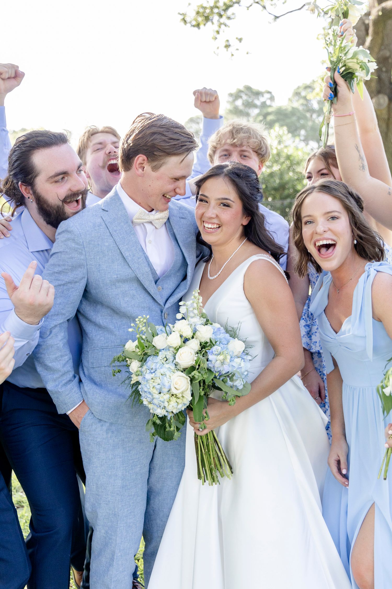 Candid wedding moments of laughter and joy at a San Antonio reception, photographed by a luxury photographer.