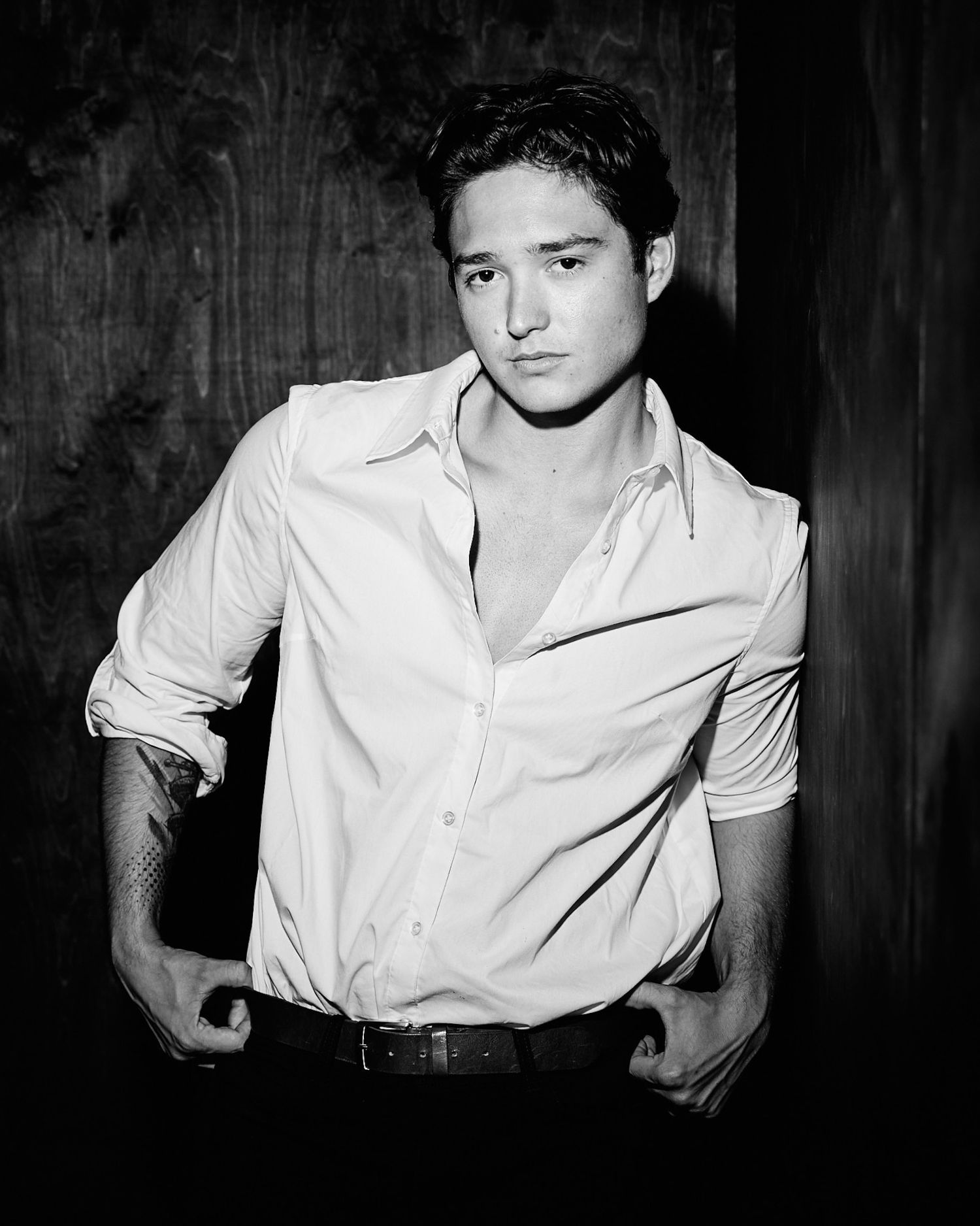 Black and white portrait series featuring someone in a white button-down shirt.
