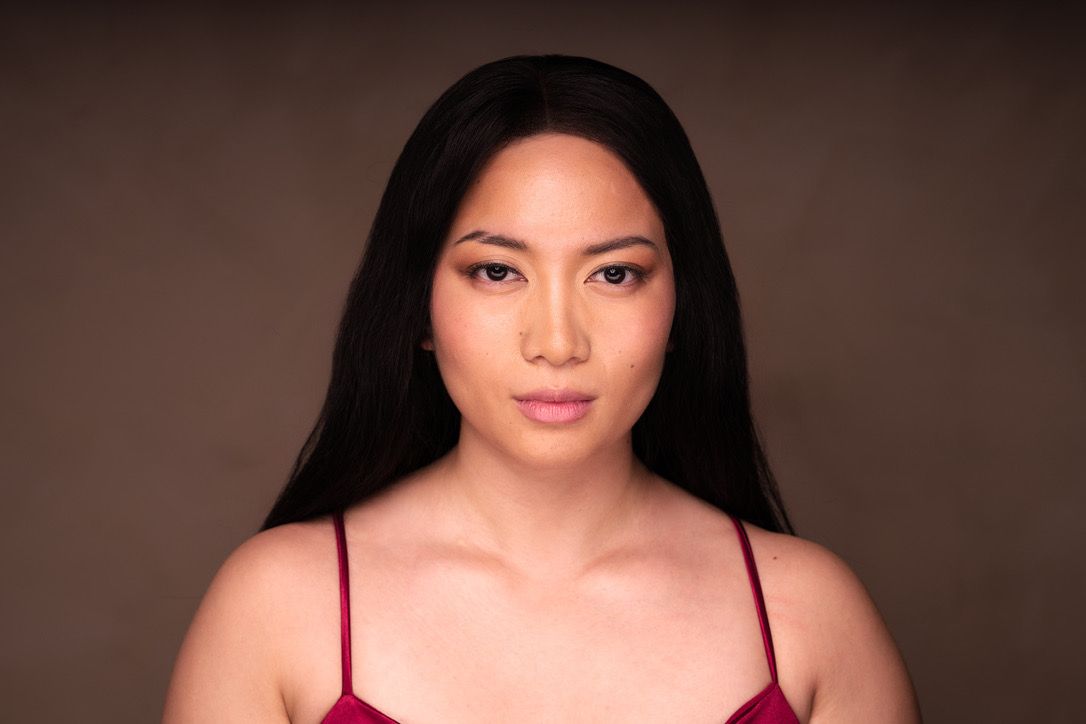 Portrait series showing emotional expressions in red top against brown background.