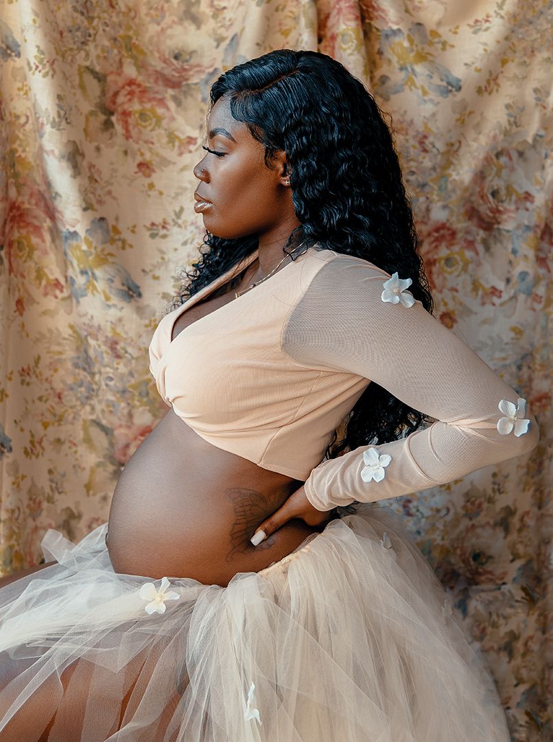 Artistic maternity photos showing profile poses in nude wrap top and flowing tulle.