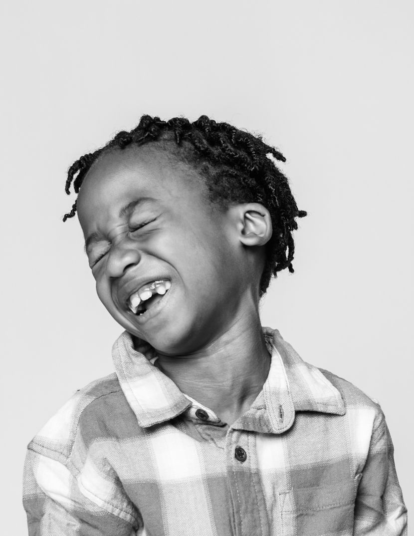 Black and white portrait series showing joyful expressions and natural movement.