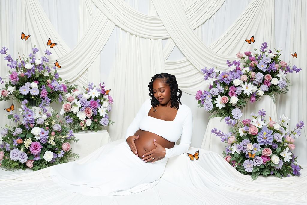 Elegant wedding backdrop with white drapes and lavender floral arrangements featuring roses and butterflies.