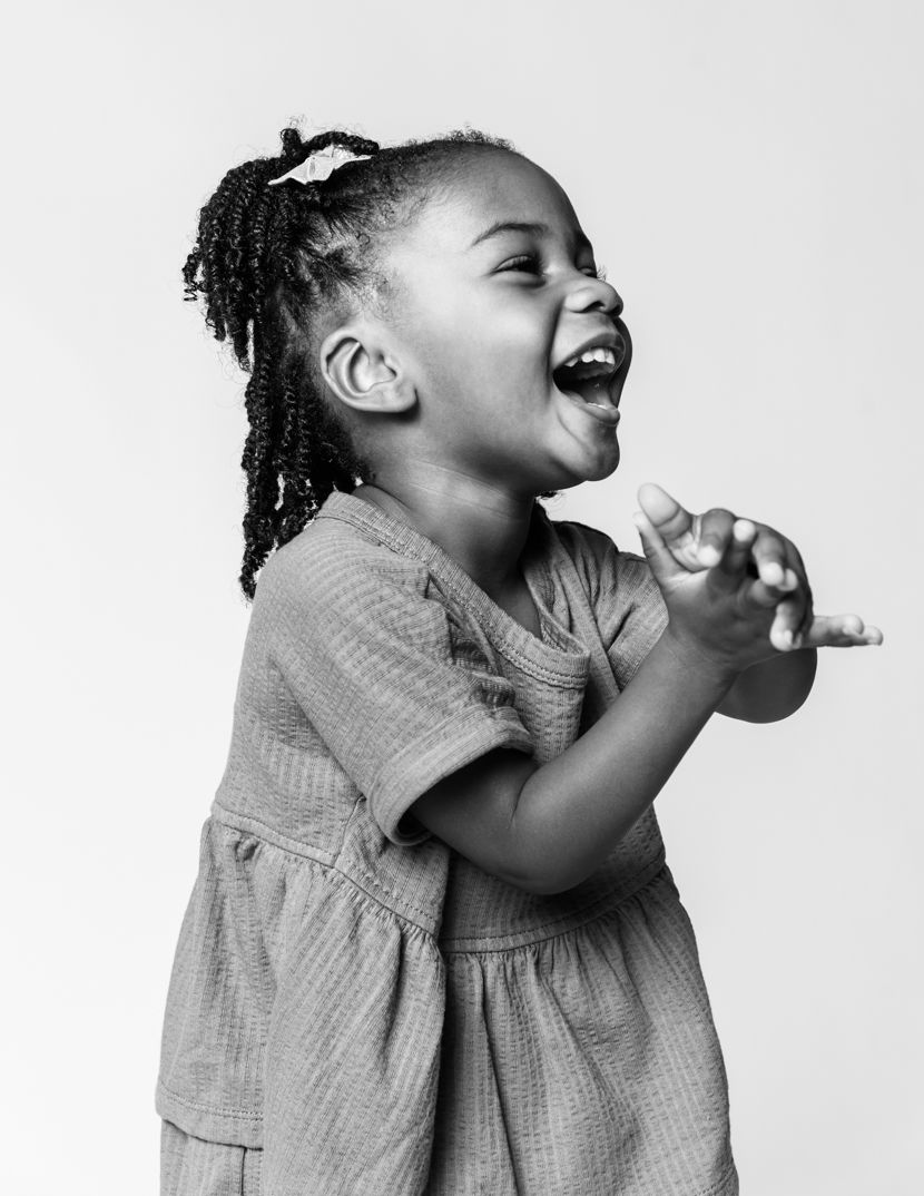 Black and white series showing candid laughter and genuine emotion.