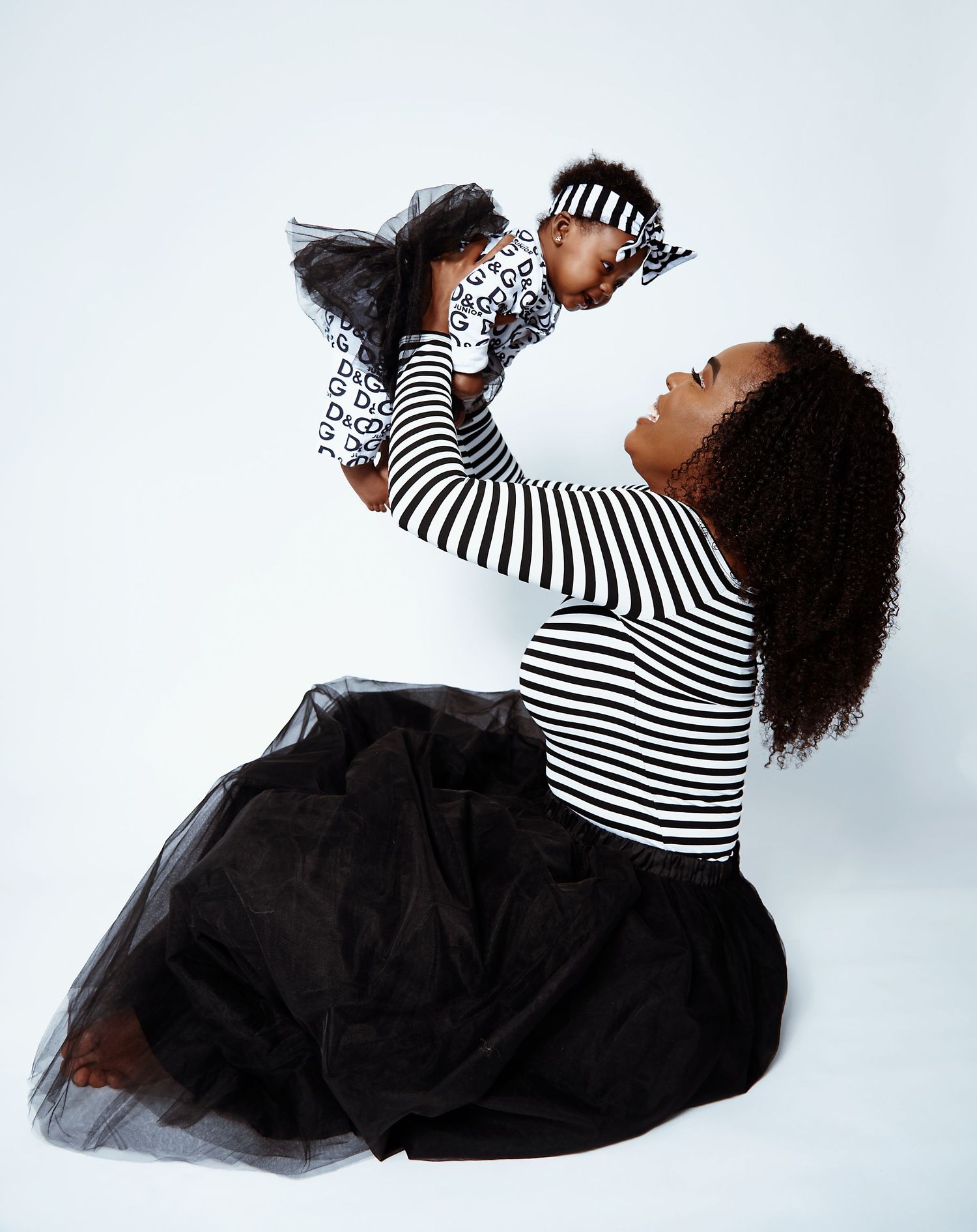 Dynamic poses of someone in a striped top and black tulle skirt against white background.