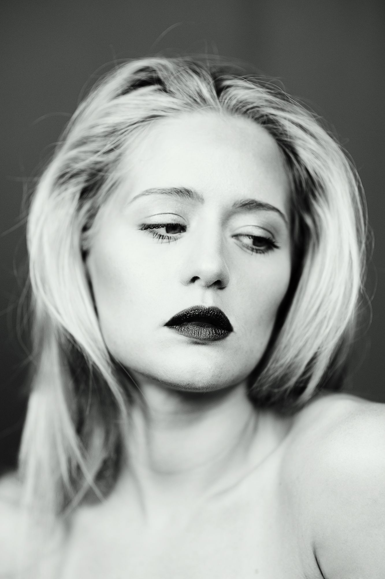 Black and white glamour portraits showing dramatic makeup and hair styling.