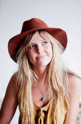 Fashion portraits of a person in a burgundy hat and blonde hair against white background.