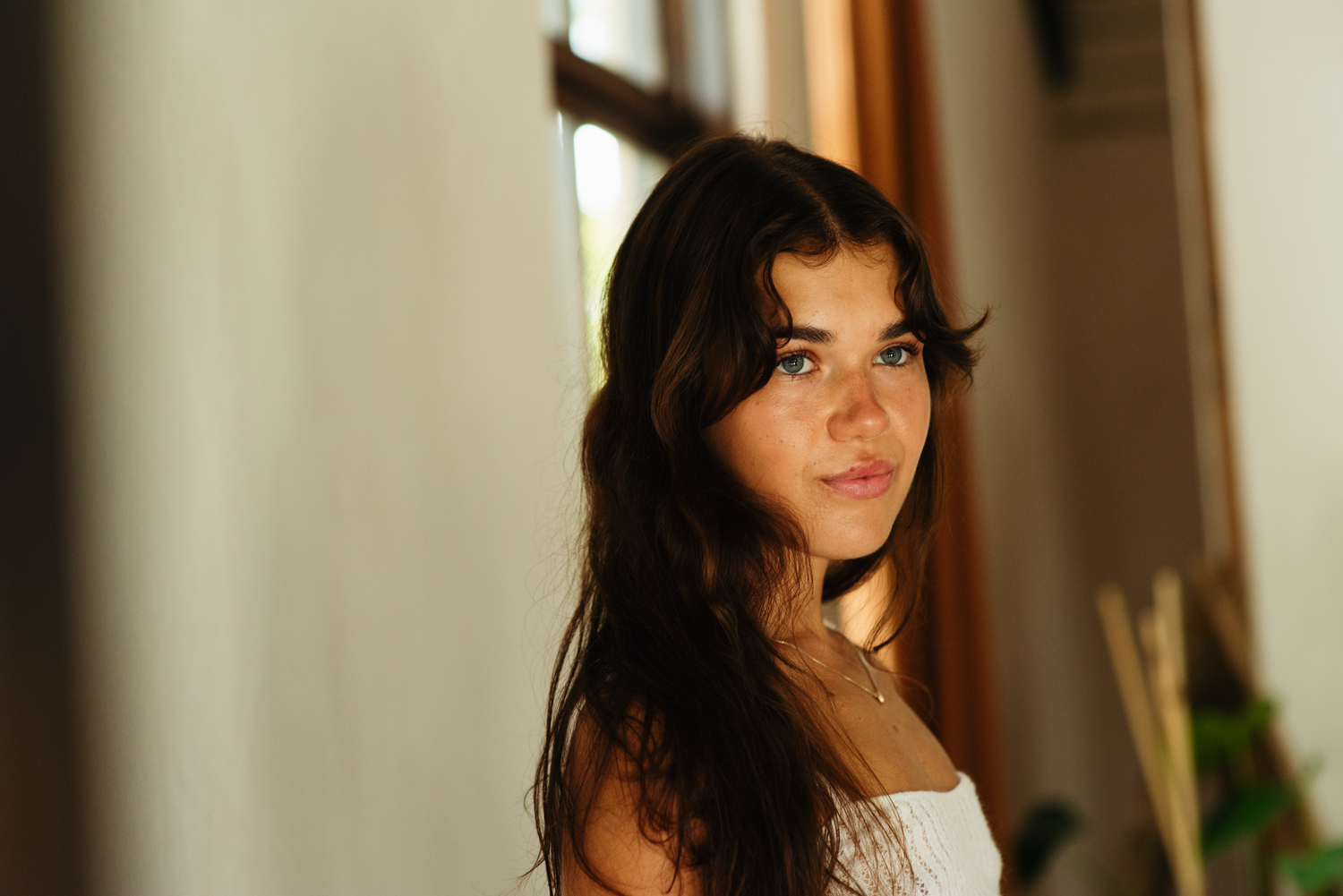 Soft natural light portraits with warm tones and gentle expressions.