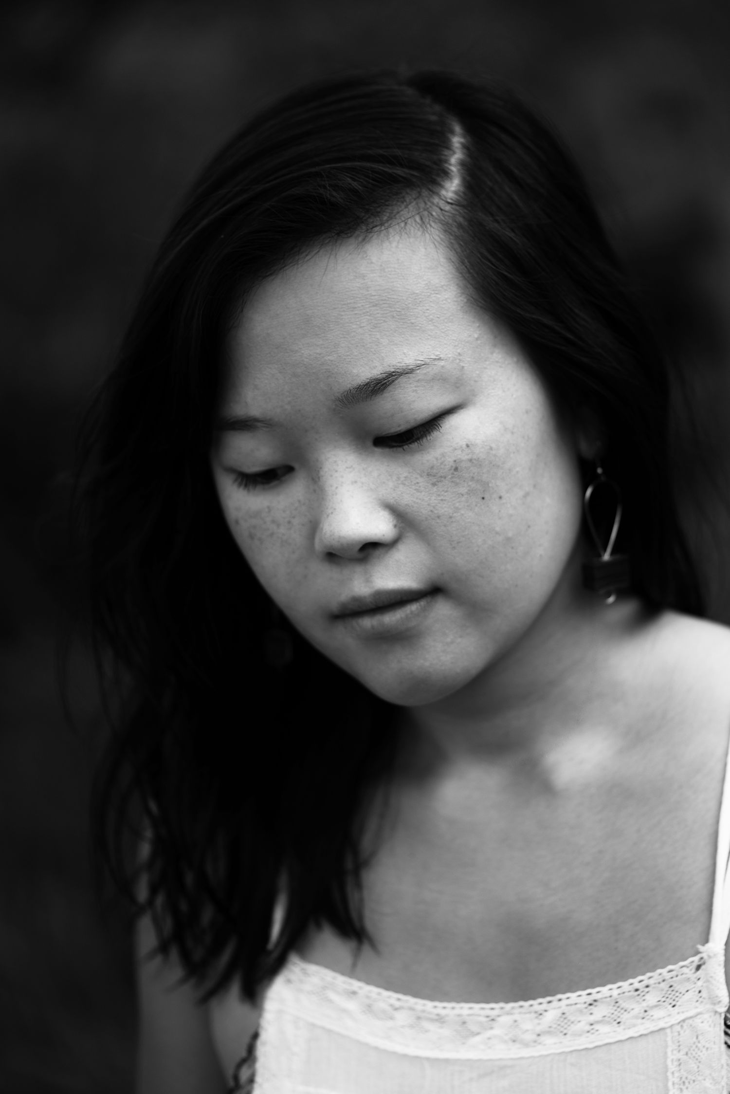 Black and white portrait sequence showing intimate angles of a woman with short dark hair.