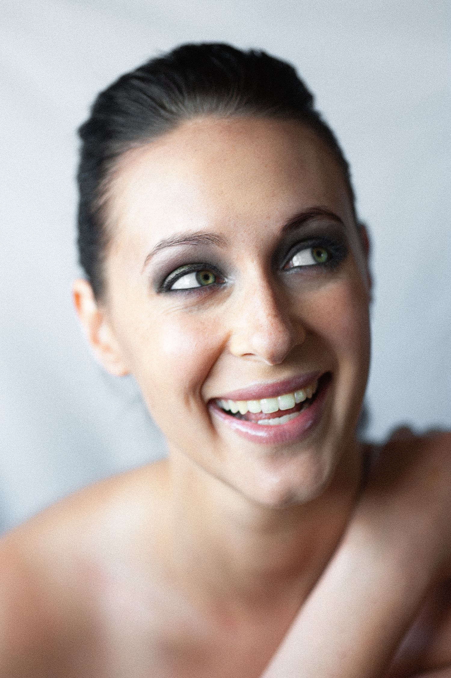 Beauty portrait with natural makeup and against light background.
