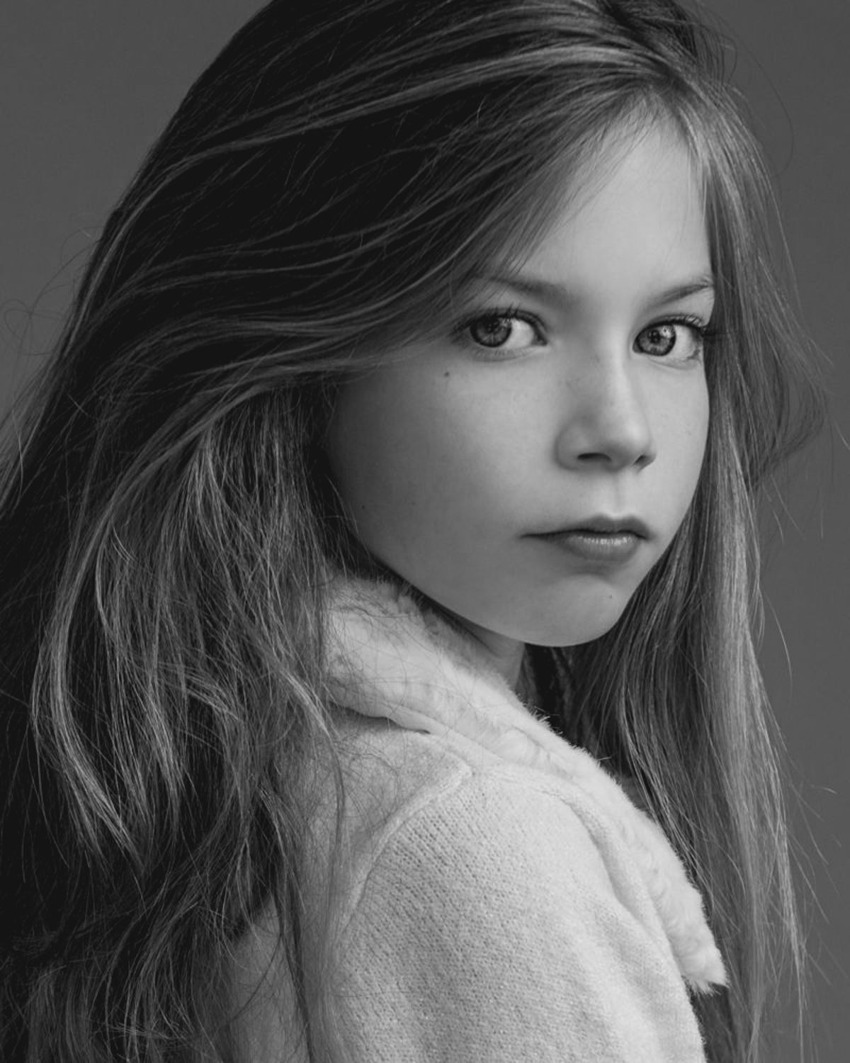 Black and white portrait series with textured white sweater.
