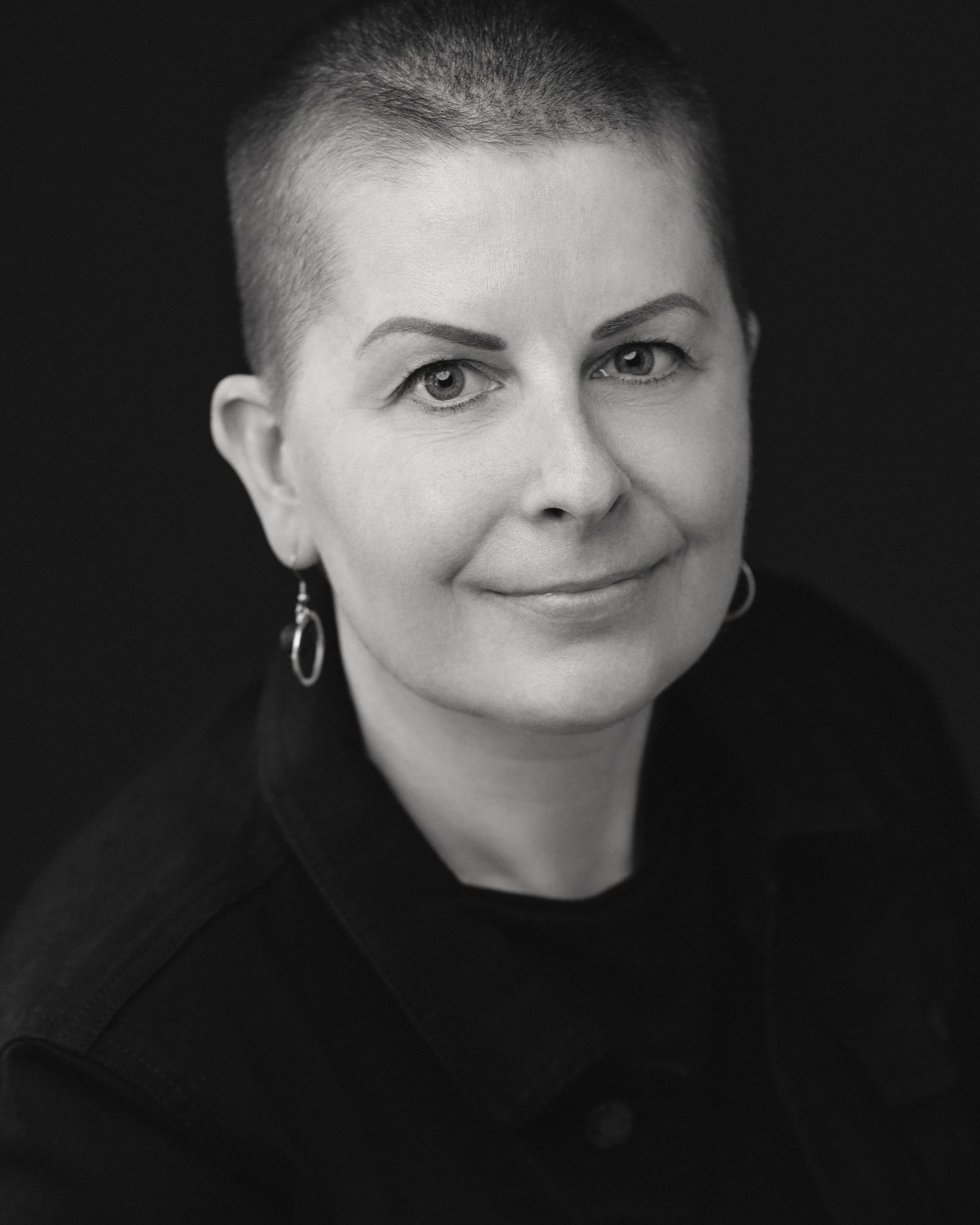 Black and white portrait series showing different facial expressions and angles against dark background.