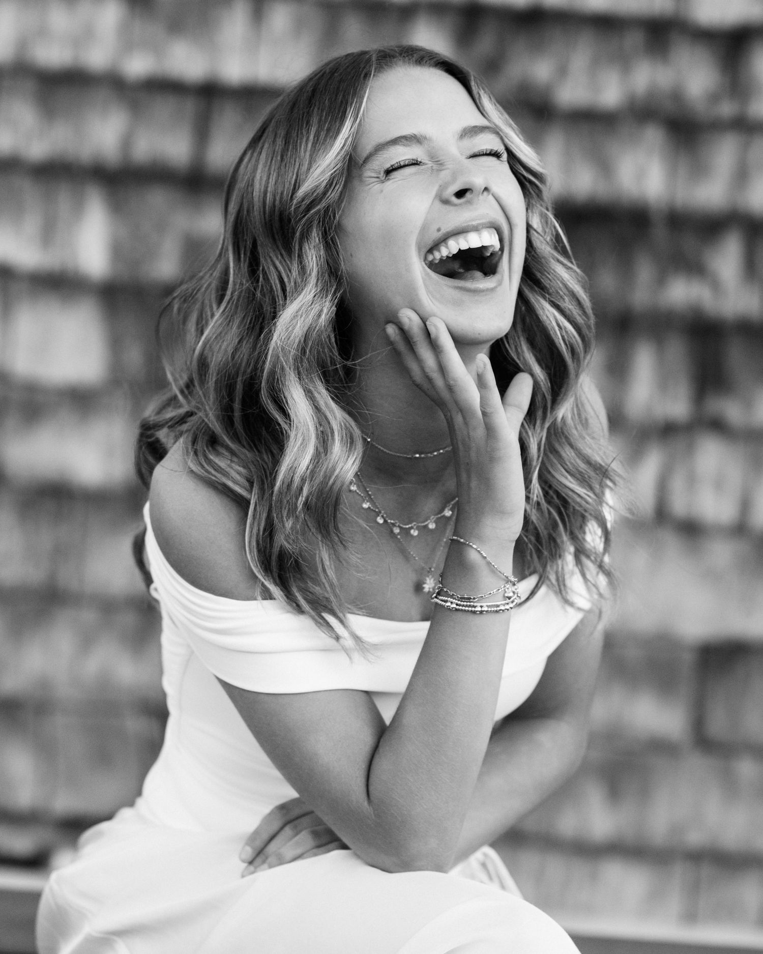 Black and white portrait series showing joyful expressions and genuine laughter.