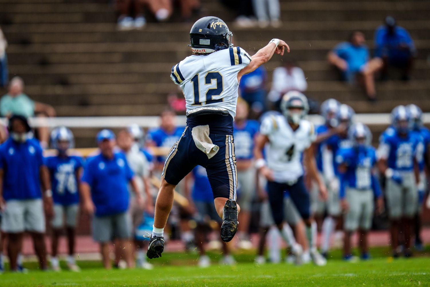 Football player kicking the ball during a field goal attempt.