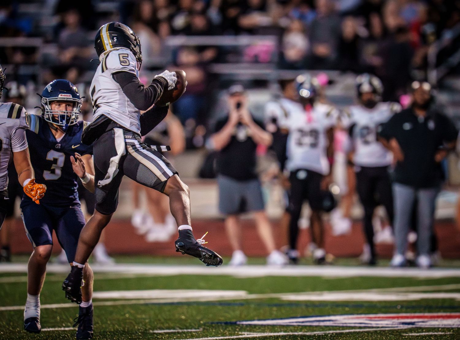 Football players in action during intense game play.