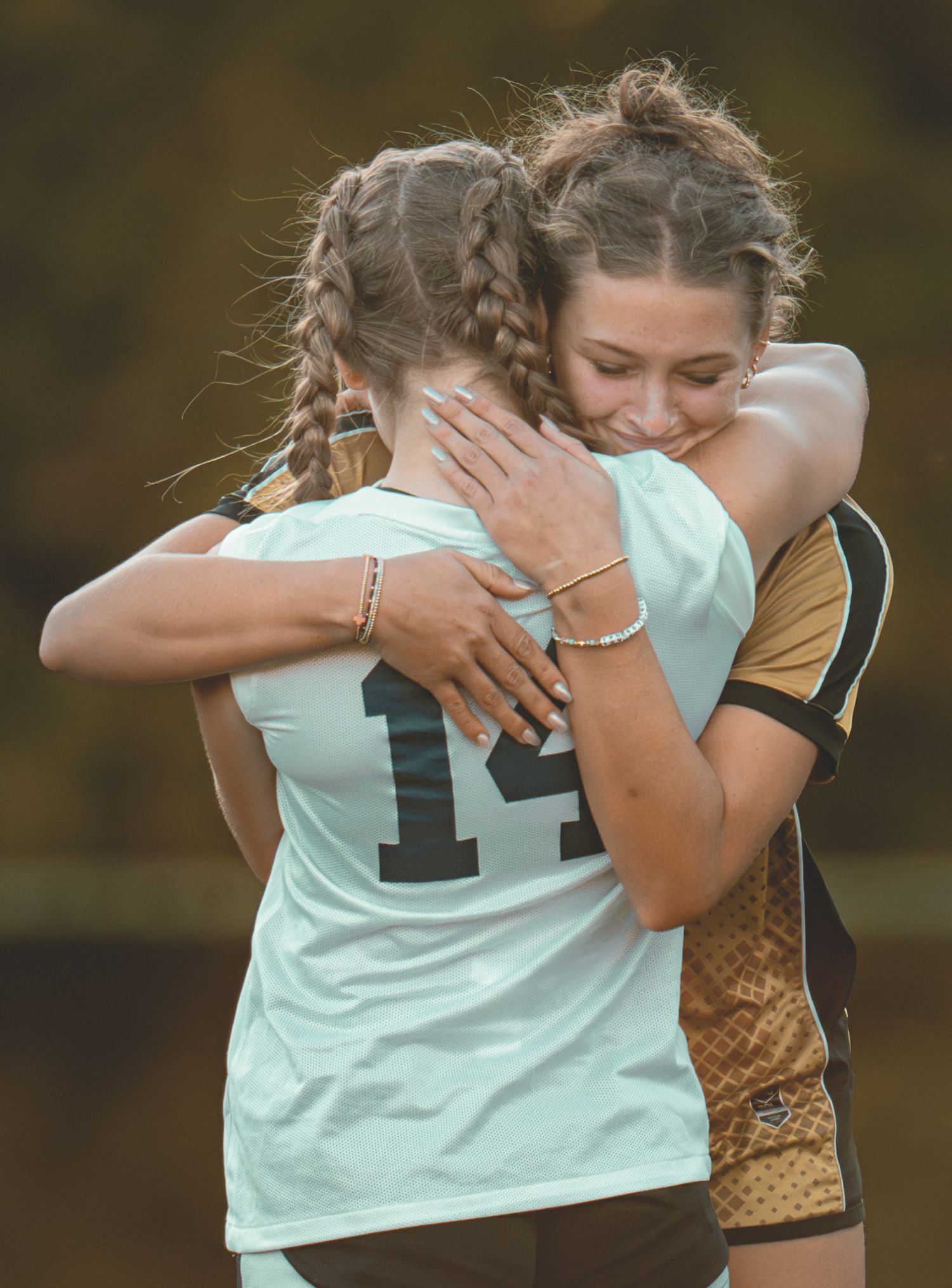 Athletes in sports uniforms showing emotional reactions during a game.