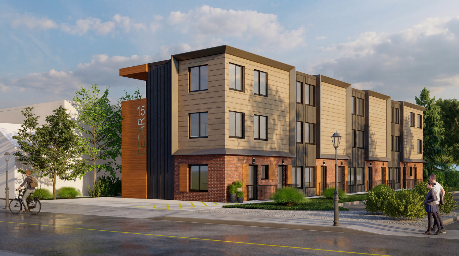 Contemporary townhouse development with brown and beige exterior featuring geometric architectural elements.