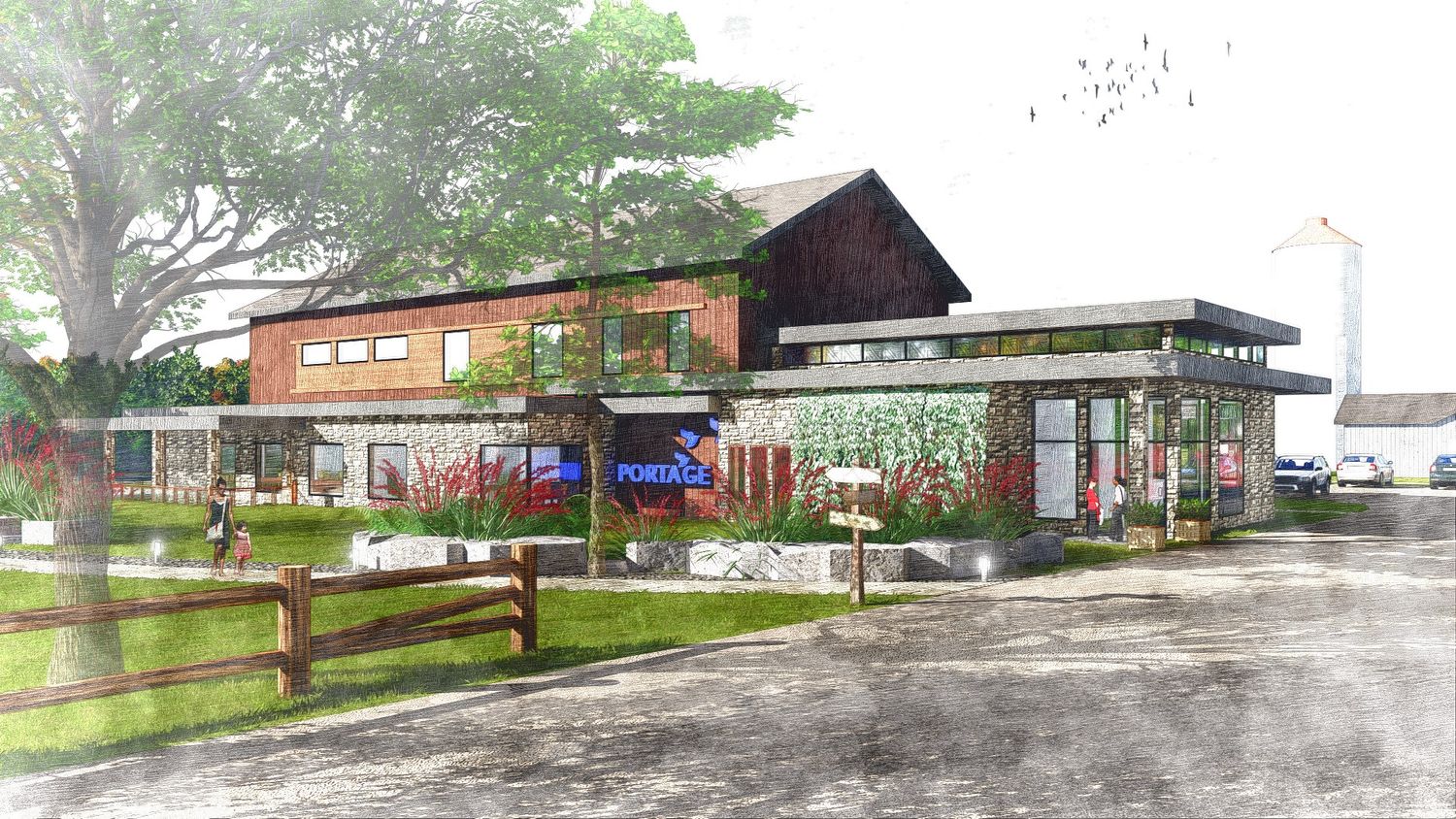 A panoramic view of a rural school building complex with playground equipment and trees in the surrounding area.