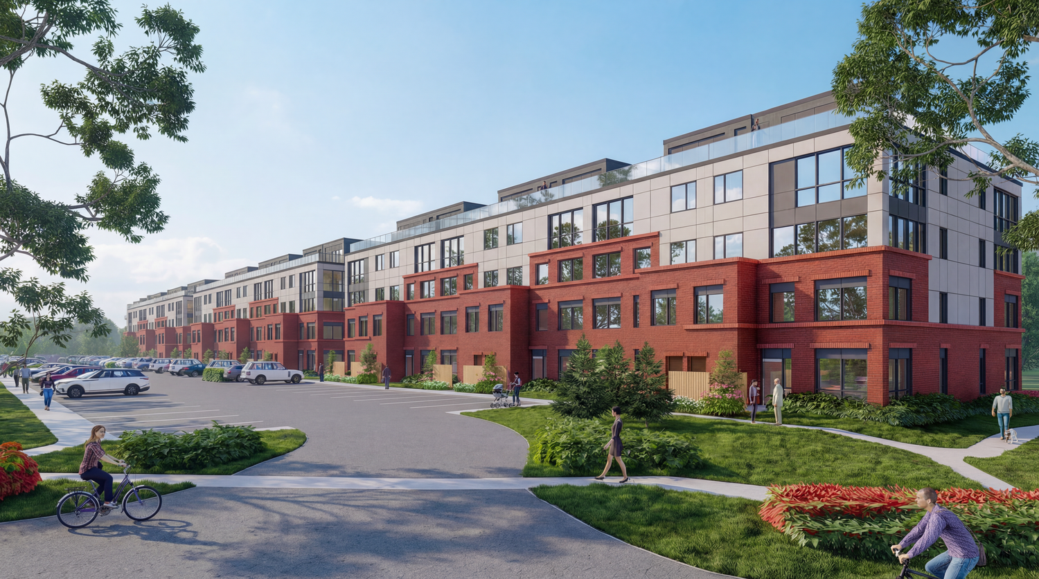 Modern apartment complex exterior with red brick and white trim shown in a panoramic view of multiple connected buildings.