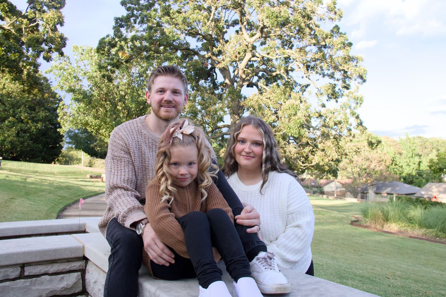 Candid family lifestyle photography by Haug & Bees Media featuring a joyful moment between parents and their child.