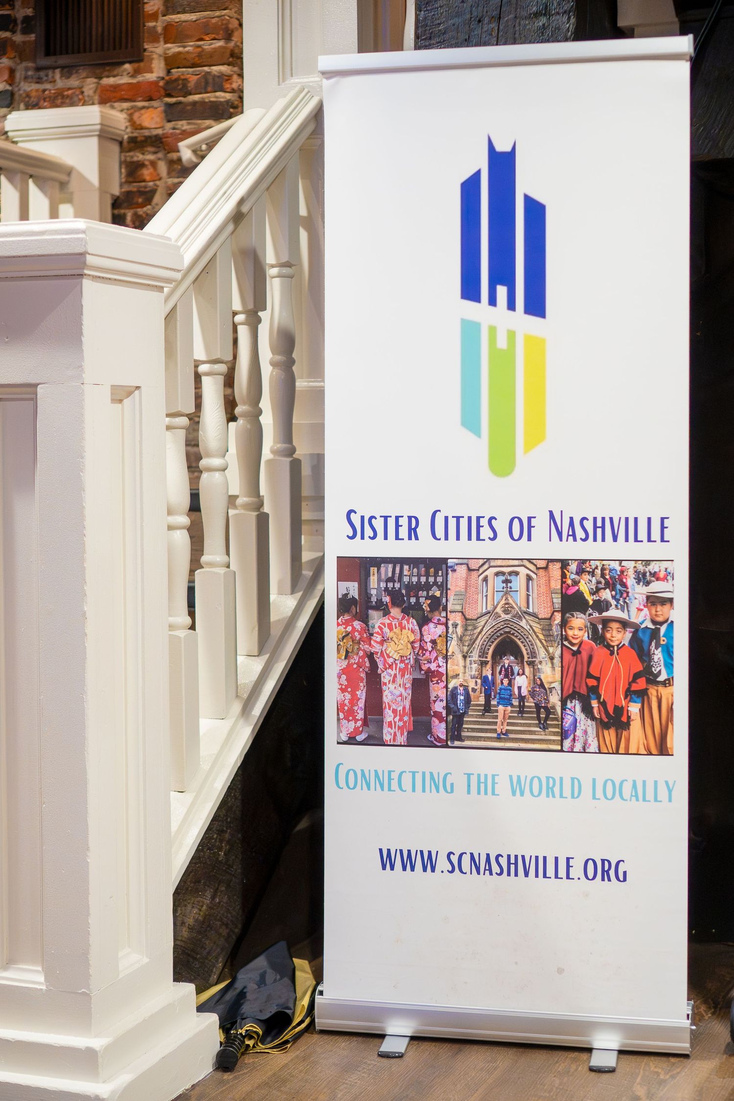 Sister Cities of Nashville banner display with logo and website information.