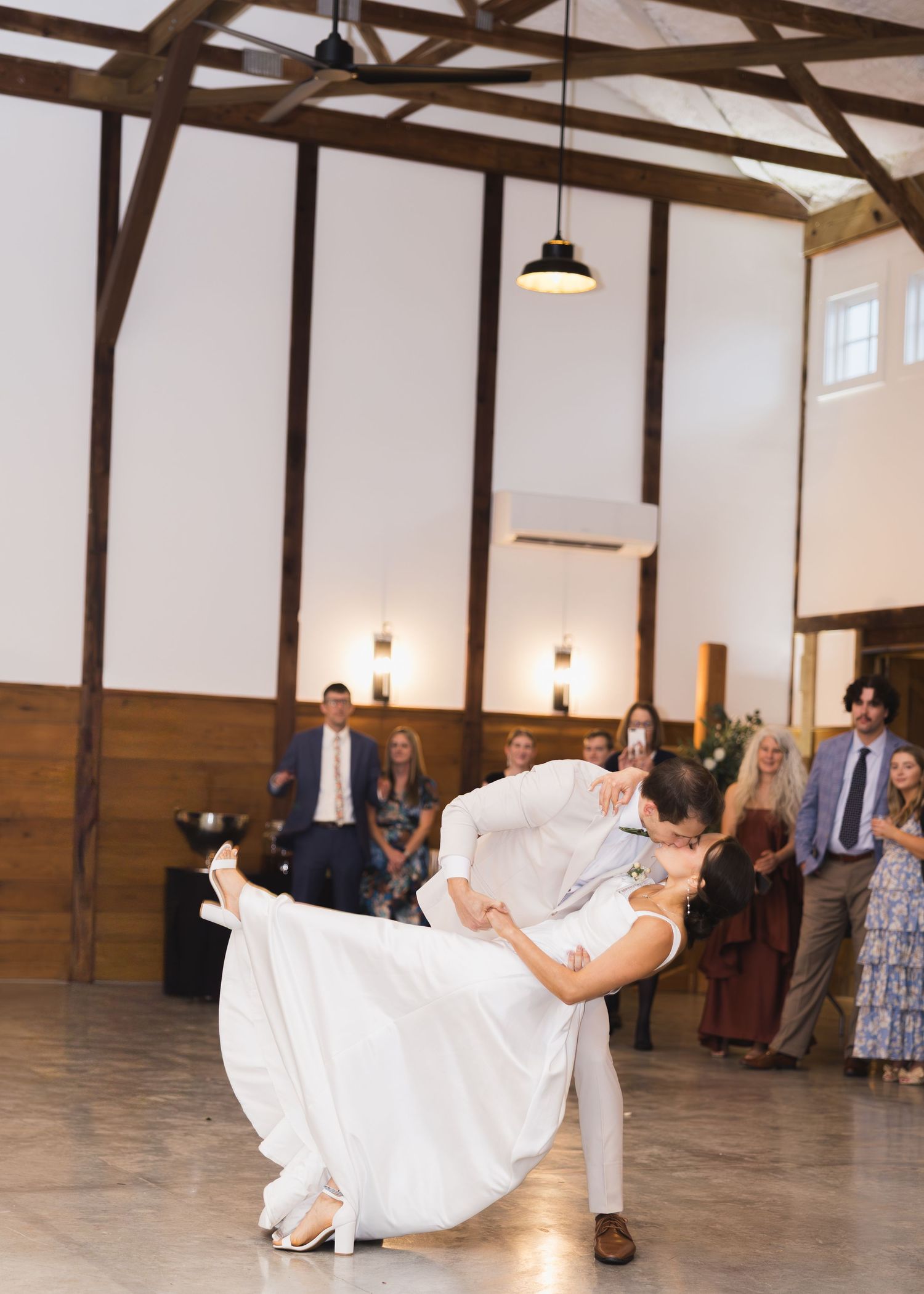Groom dipping the bride to kiss