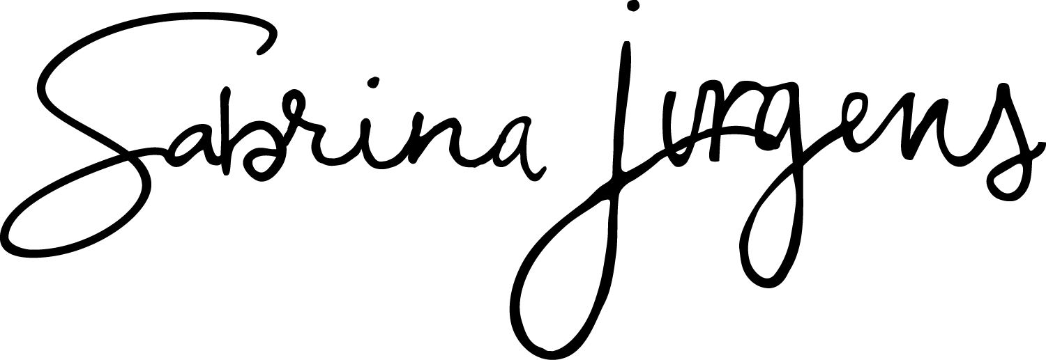 Elegant cursive signature reading Sabrina Jurgens in black ink on a white background.