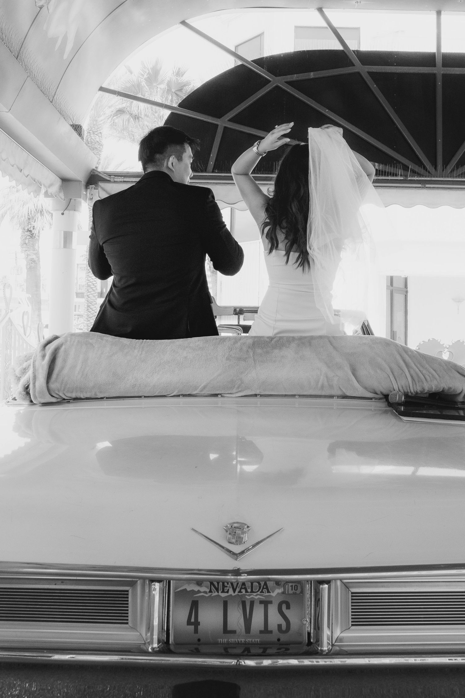 A vintage car with Nevada license plates photographed in black and white.