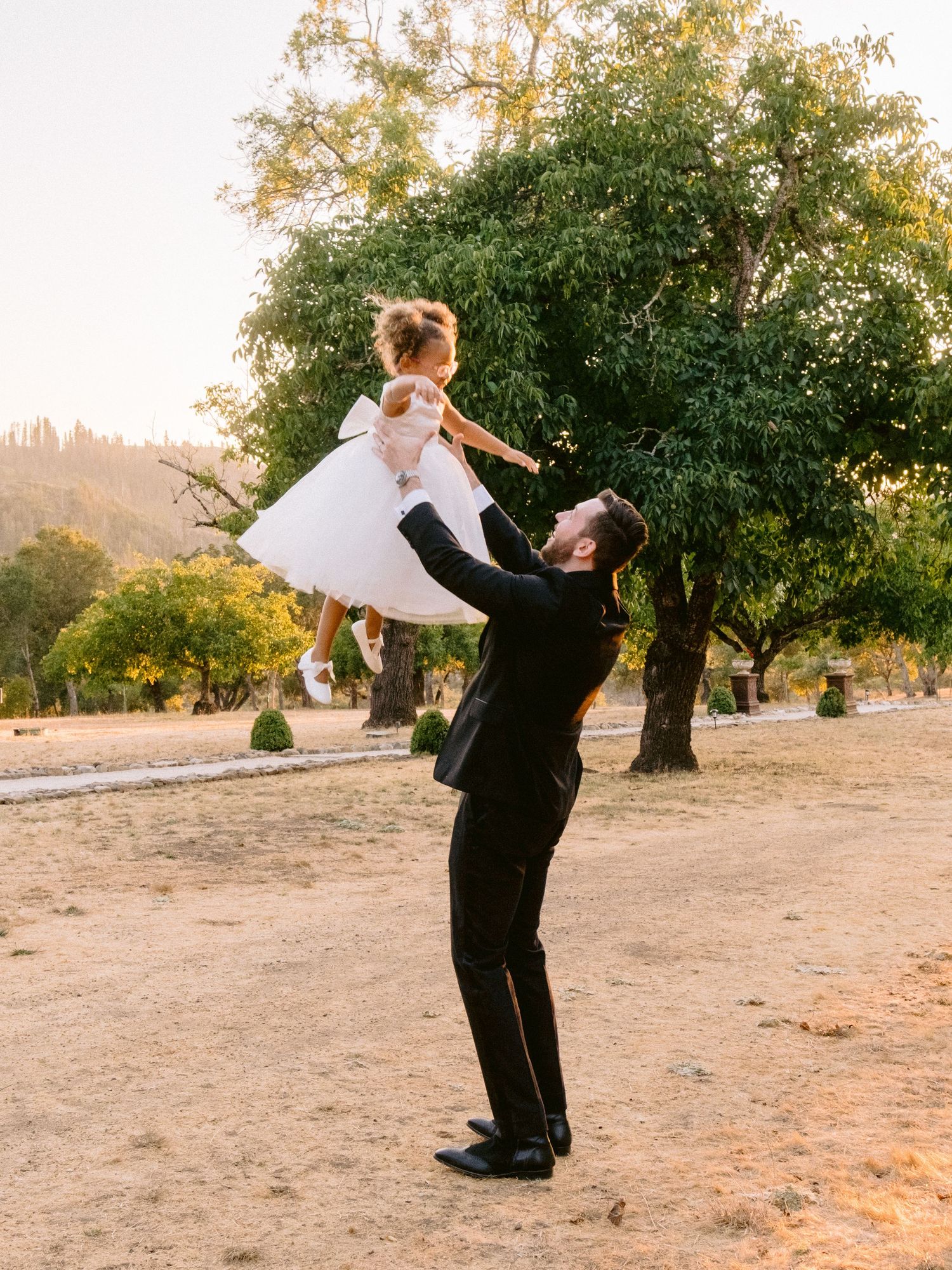 A romantic dance sequence outdoors with dramatic lifts and spins at sunset.